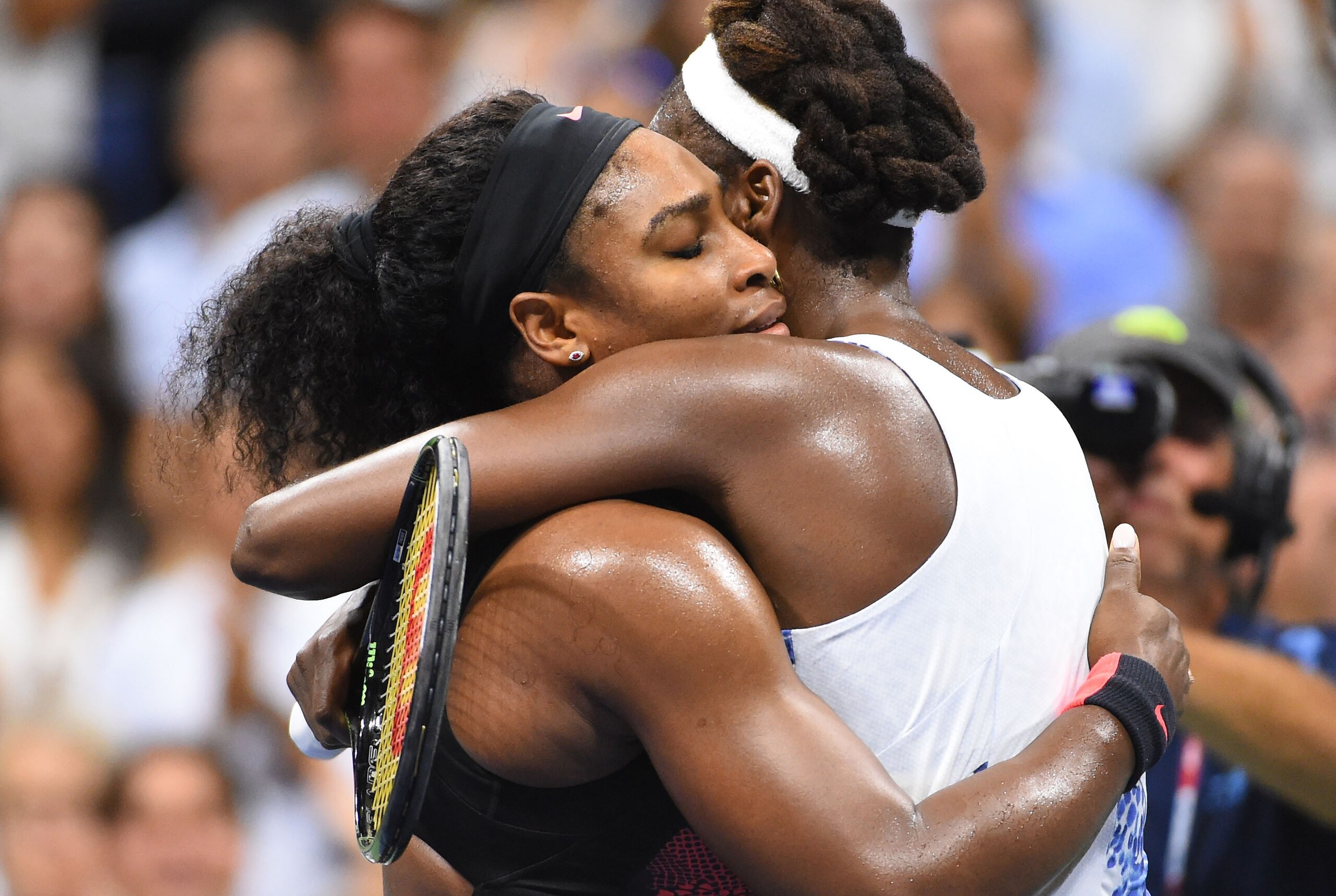 Sep 8, 2015; New York, NY, USA; Serena Williams of the USA (left) hugs sister Venus Williams of the USA after their match on day nine of the 2015 U.S. Open tennis tournament at USTA Billie Jean King National Tennis Center. Mandatory Credit: Robert Deutsch