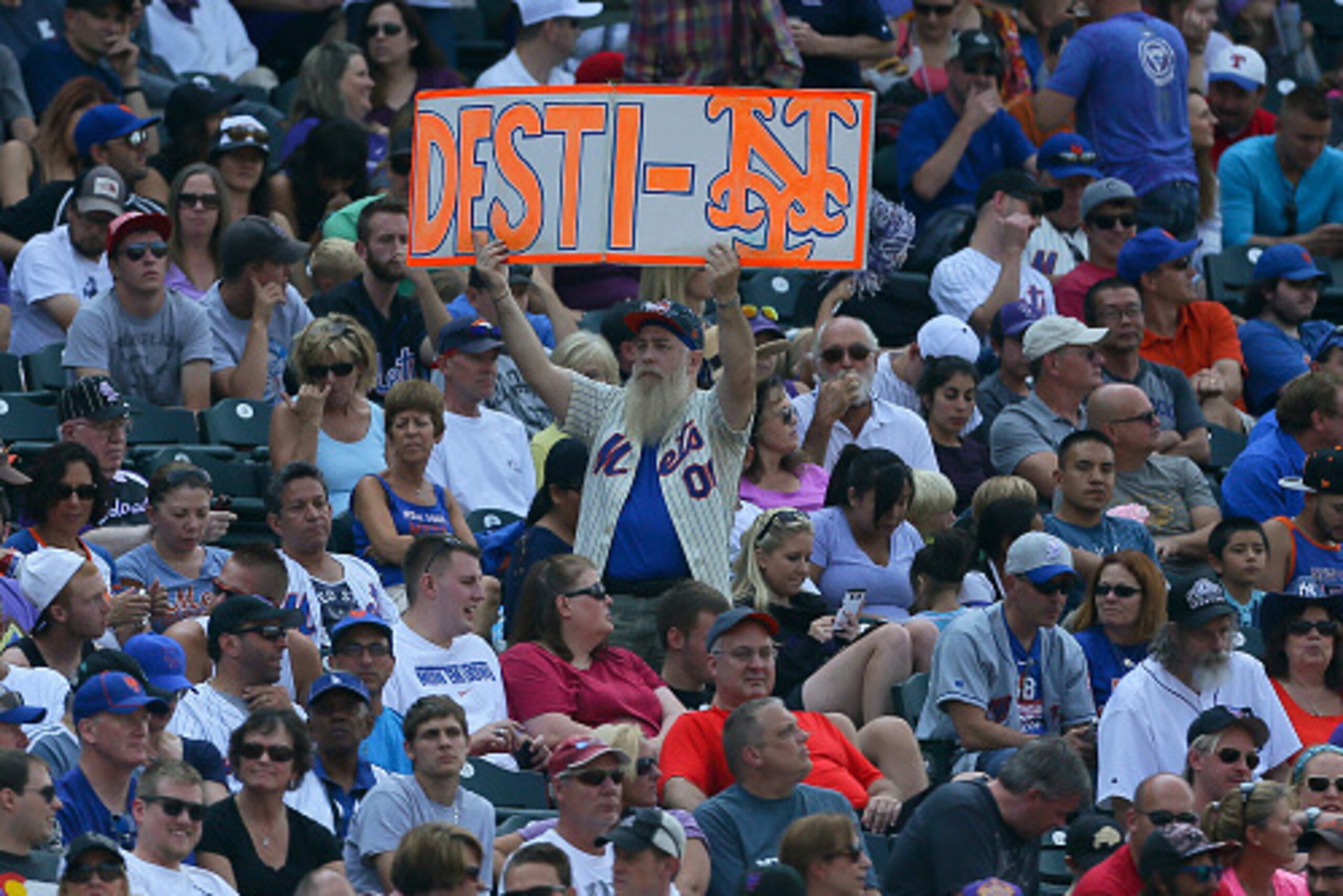 DENVER, CO - AUGUST 23:  A New York Mets fan holds up a sign as he roots for his team during a game against the Colorado Rockies at Coors Field on August 23, 2015 in Denver, Colorado. The Mets defeated the Rockies 5-1 to sweep the three game series. (Phot