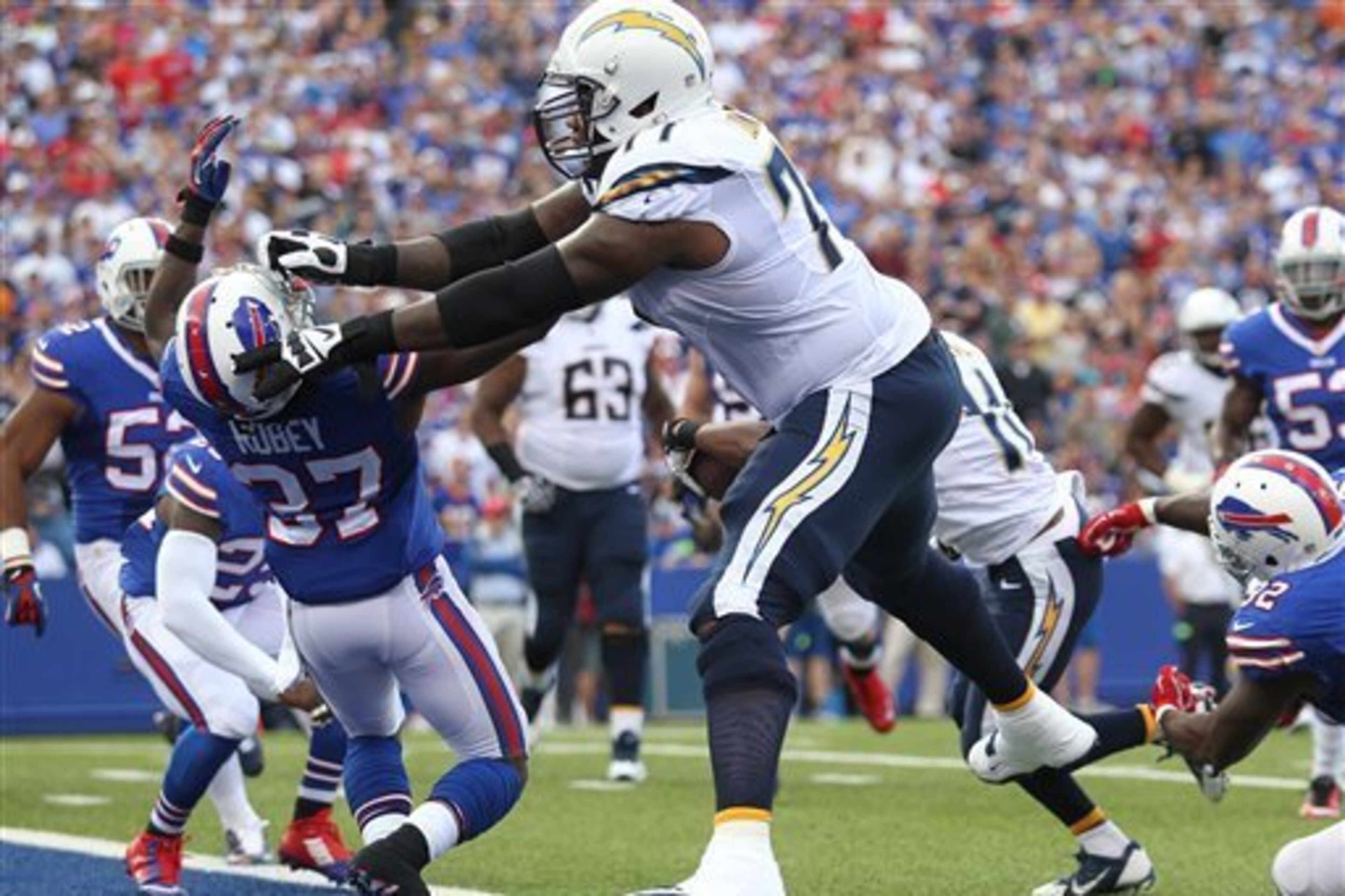 San Diego Chargers left tackle King Dunlap blocks Buffalo Bills cornerback Nickell Robey during a 2014 contest.