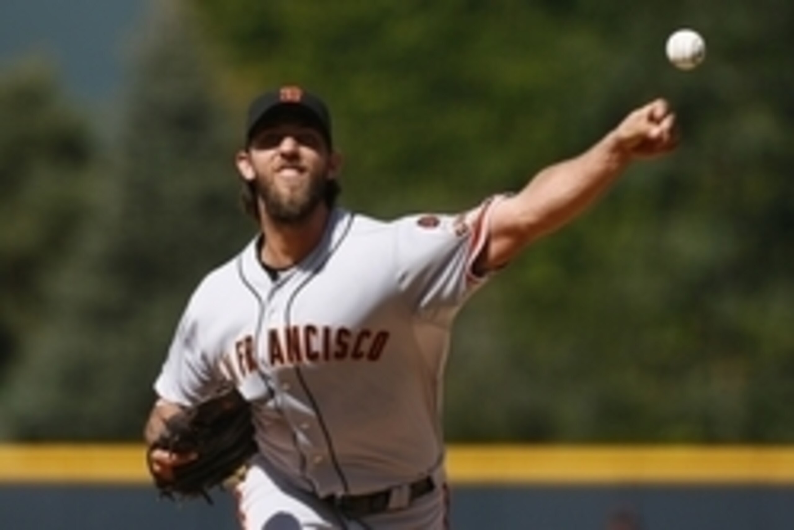 Sep 6, 2015; Denver, CO, USA; San Francisco Giants starting pitcher Madison Bumgarner (40) delivers a pitch in the first inning against the Colorado Rockies at Coors Field. Mandatory Credit: Isaiah J. Downing-USA TODAY Sports