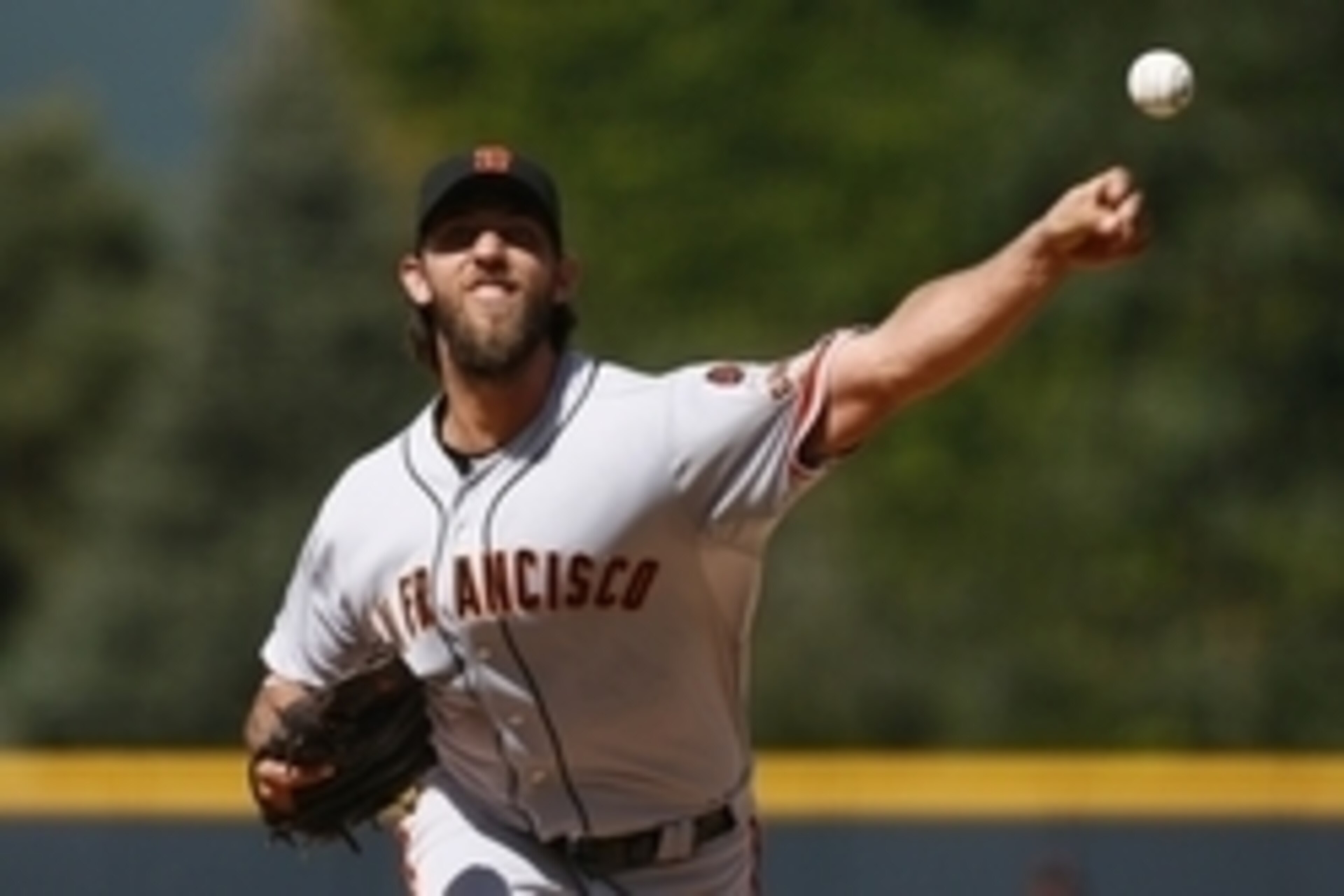 Sep 6, 2015; Denver, CO, USA; San Francisco Giants starting pitcher Madison Bumgarner (40) delivers a pitch in the first inning against the Colorado Rockies at Coors Field. Mandatory Credit: Isaiah J. Downing-USA TODAY Sports