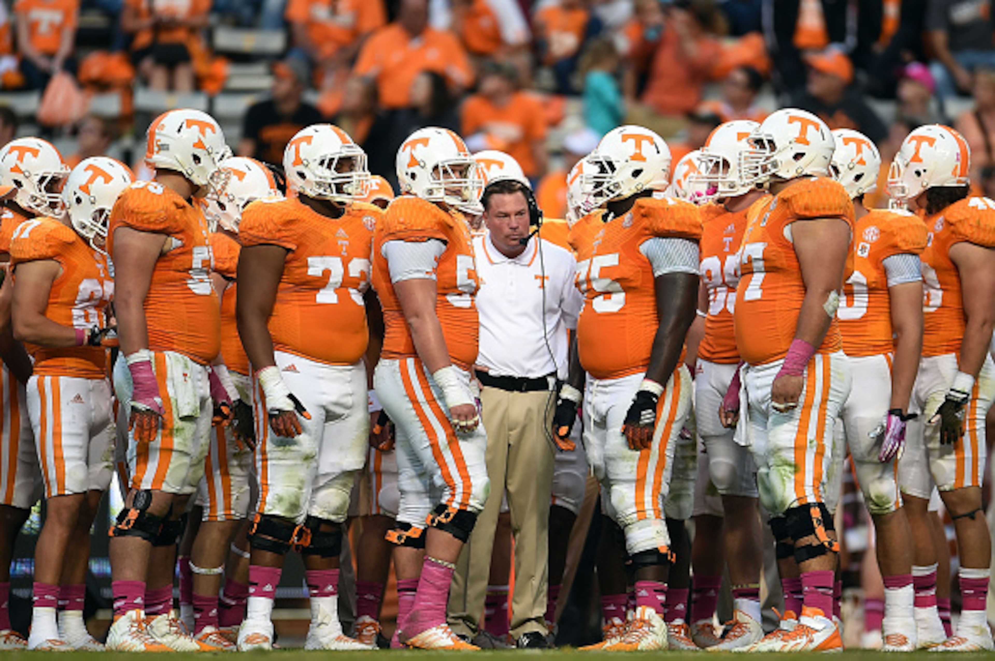KNOXVILLE, TN - OCTOBER 11: Head coach Butch Jones of the Tennessee Volunteers gathers with his team during a game against the Chattanooga Mocs at Neyland Stadium on October 11, 2014 in Knoxville, Tennessee. Tennessee won the game 45-10.  (Photo by Stacy 