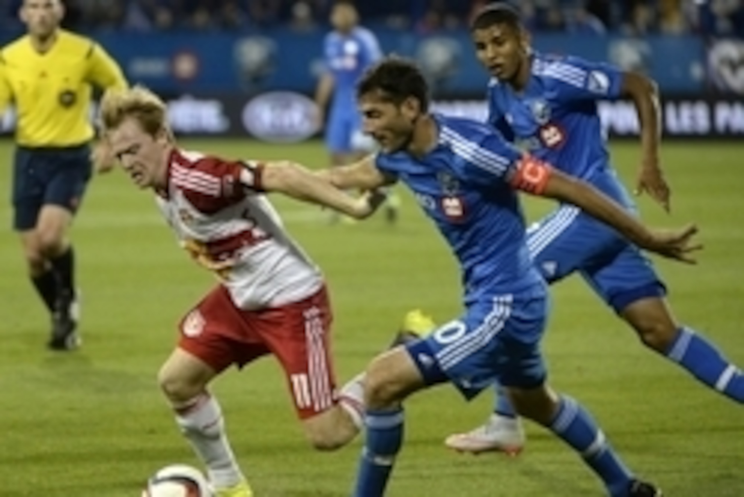 Aug 5, 2015; Montreal, Quebec, CAN; Montreal Impact midfielder Ignacio Piatti (10) and New York Red Bulls midfielder Dax McCarty (11) battle for the ball during the second half at Stade Saputo. Mandatory Credit: Eric Bolte-USA TODAY Sports