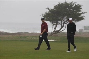 Tony Romo loves to play golf. Hanging out with Tiger Woods isn't a stretch.