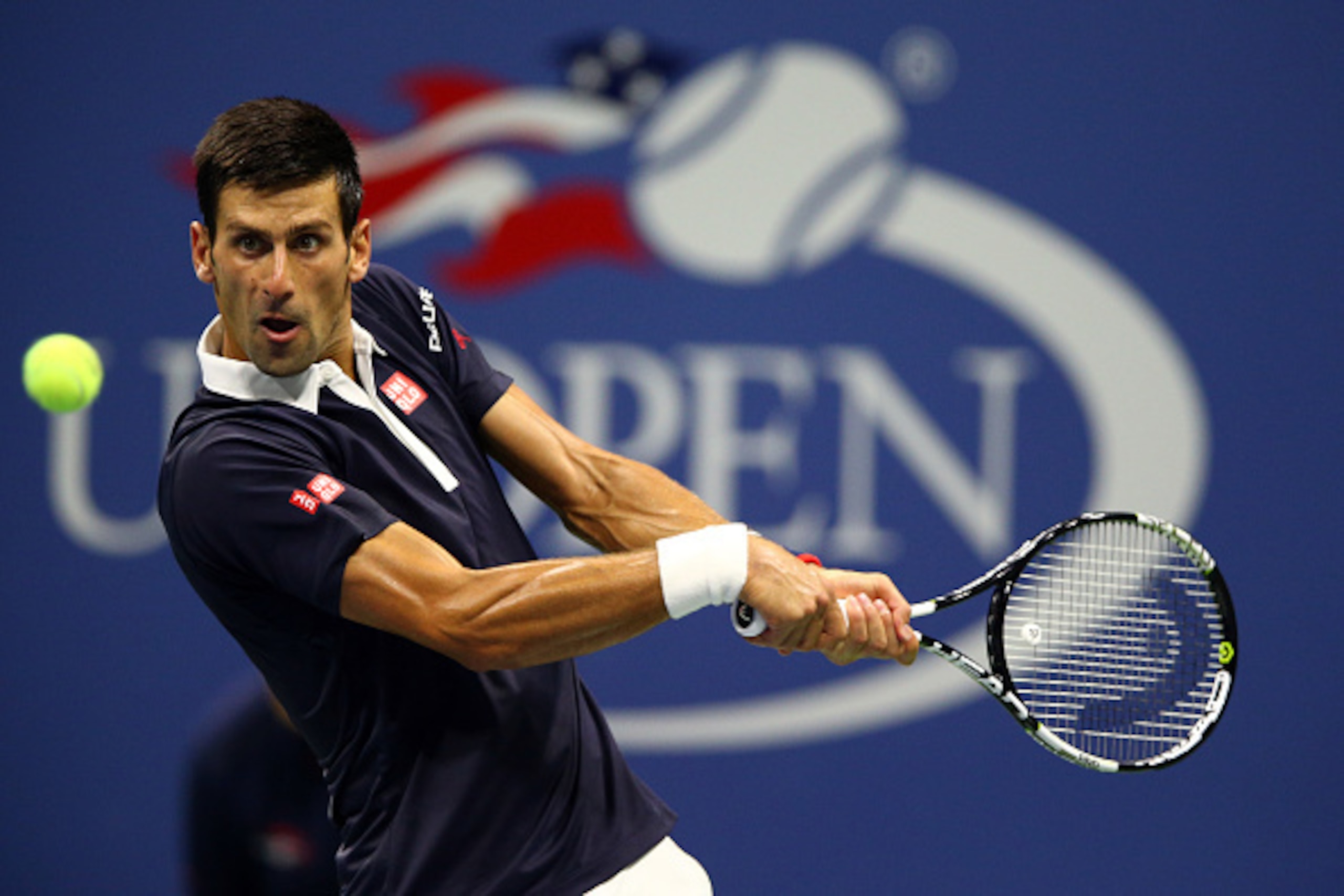 NEW YORK, NY - SEPTEMBER 08:  Novak Djokovic of Serbia returns a shot to Feliciano Lopez of Spain during their Men's Singles Quarterfinals match on Day Nine of the 2015 US Open at the USTA Billie Jean King National Tennis Center on September 8, 2015 in th