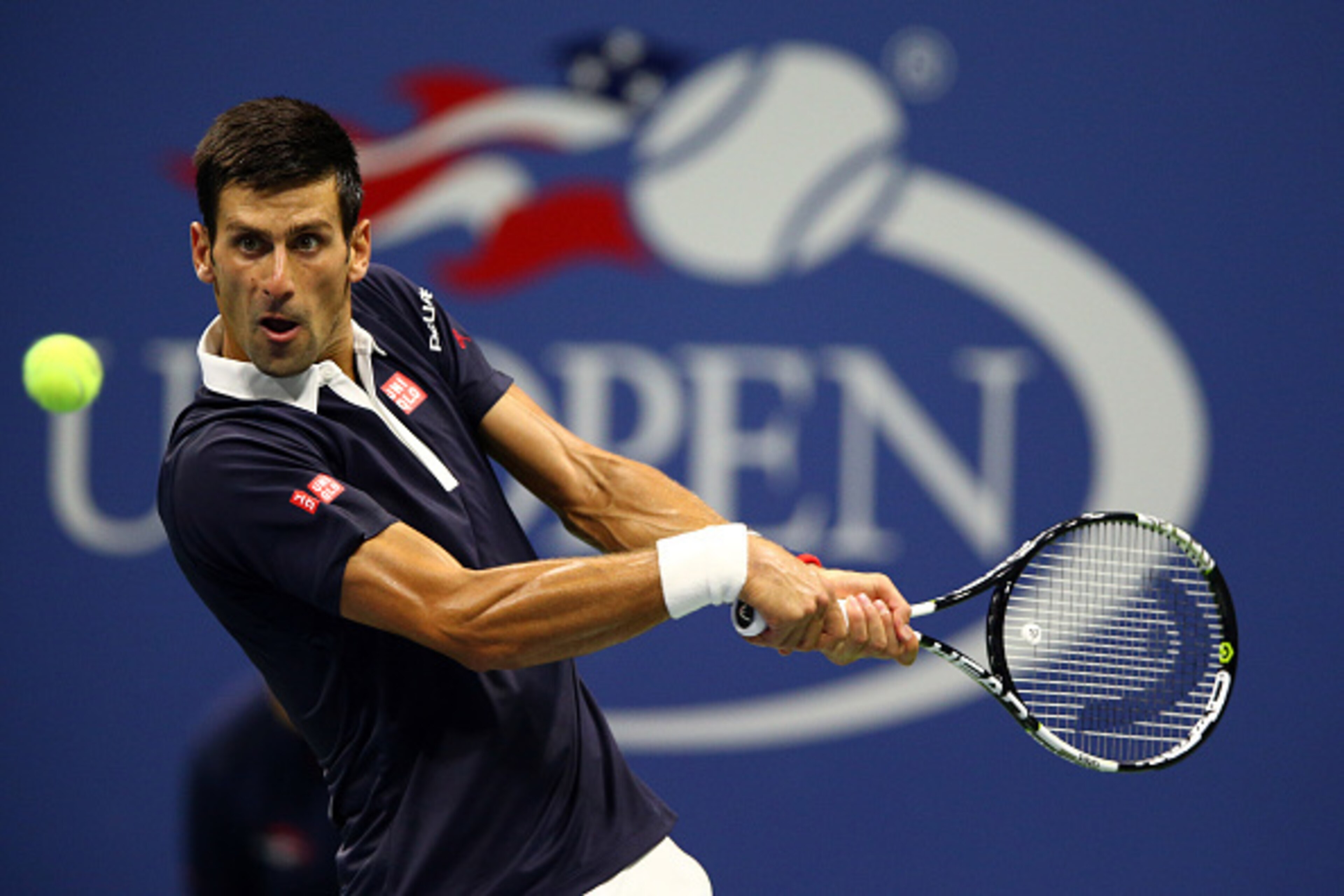 NEW YORK, NY - SEPTEMBER 08:  Novak Djokovic of Serbia returns a shot to Feliciano Lopez of Spain during their Men's Singles Quarterfinals match on Day Nine of the 2015 US Open at the USTA Billie Jean King National Tennis Center on September 8, 2015 in th