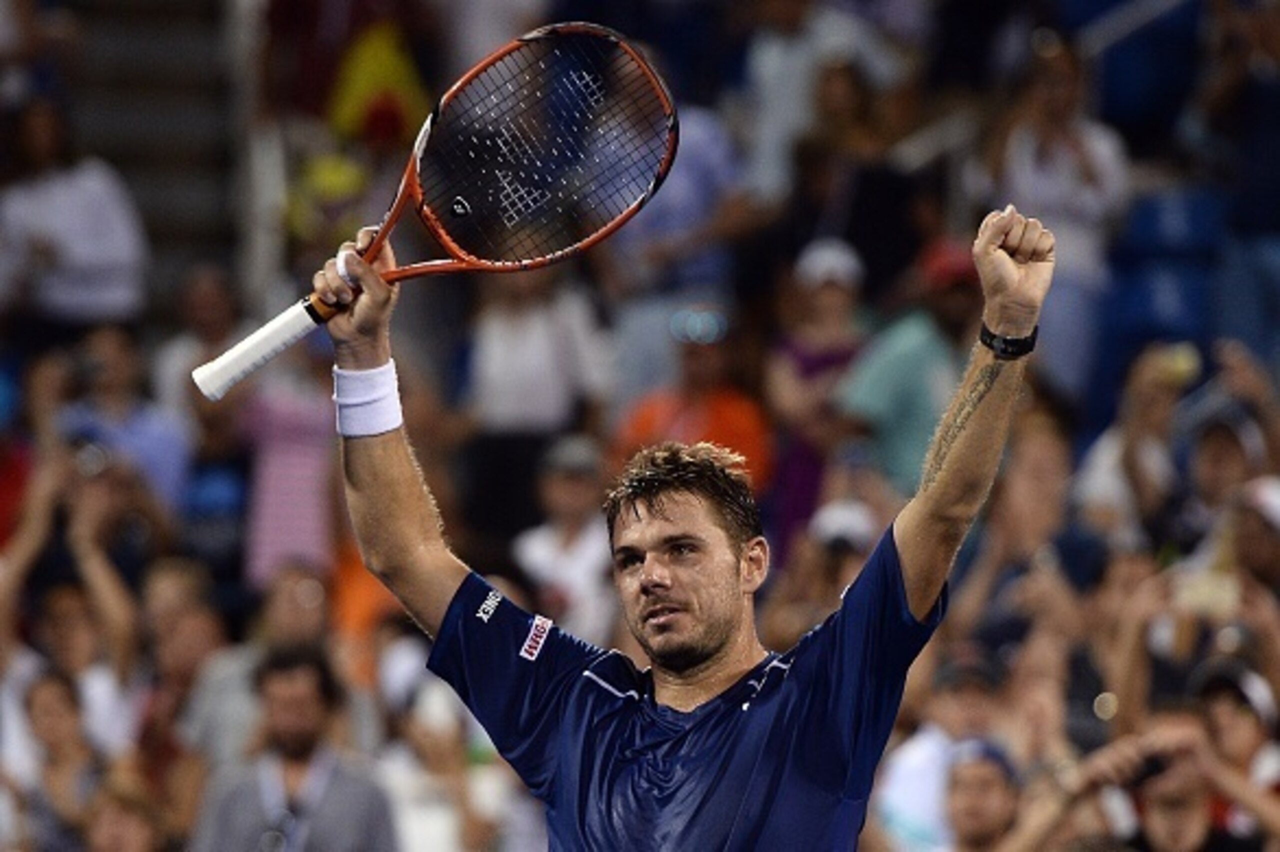 Stan Wawrinka of Switzerland celebrates after defeating Kevin Anderson of South Africa during their 2015 US Open Men's singles quarterfinals match at the USTA Billie Jean King National Tennis Center in New York on September 9, 2015. Wawrinka won 6-4, 6-4,