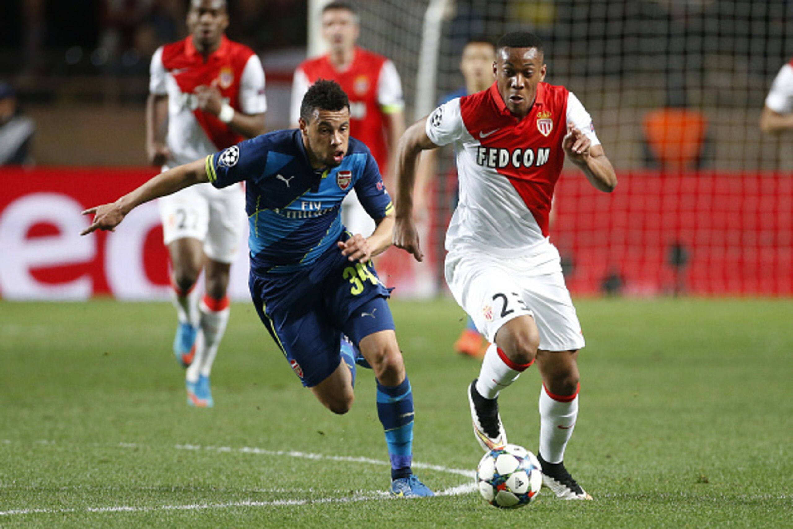 MONACO - MARCH 17: Francis Coquelin of Arsenal and Anthony Martial of Monaco in action during the UEFA Champions League round of 16 match between AS Monaco FC and Arsenal FC at Stade Louis II on March 17, 2015 in Monaco. (Photo by Jean Catuffe/Getty Imag MONACO - MARCH 17: Francis Coquelin of Arsenal and Anthony Martial of Monaco in action during the UEFA Champions League round of 16 match between AS Monaco FC and Arsenal FC at Stade Louis II on March 17, 2015 in Monaco. (Photo by Jean Catuffe/Getty Imag