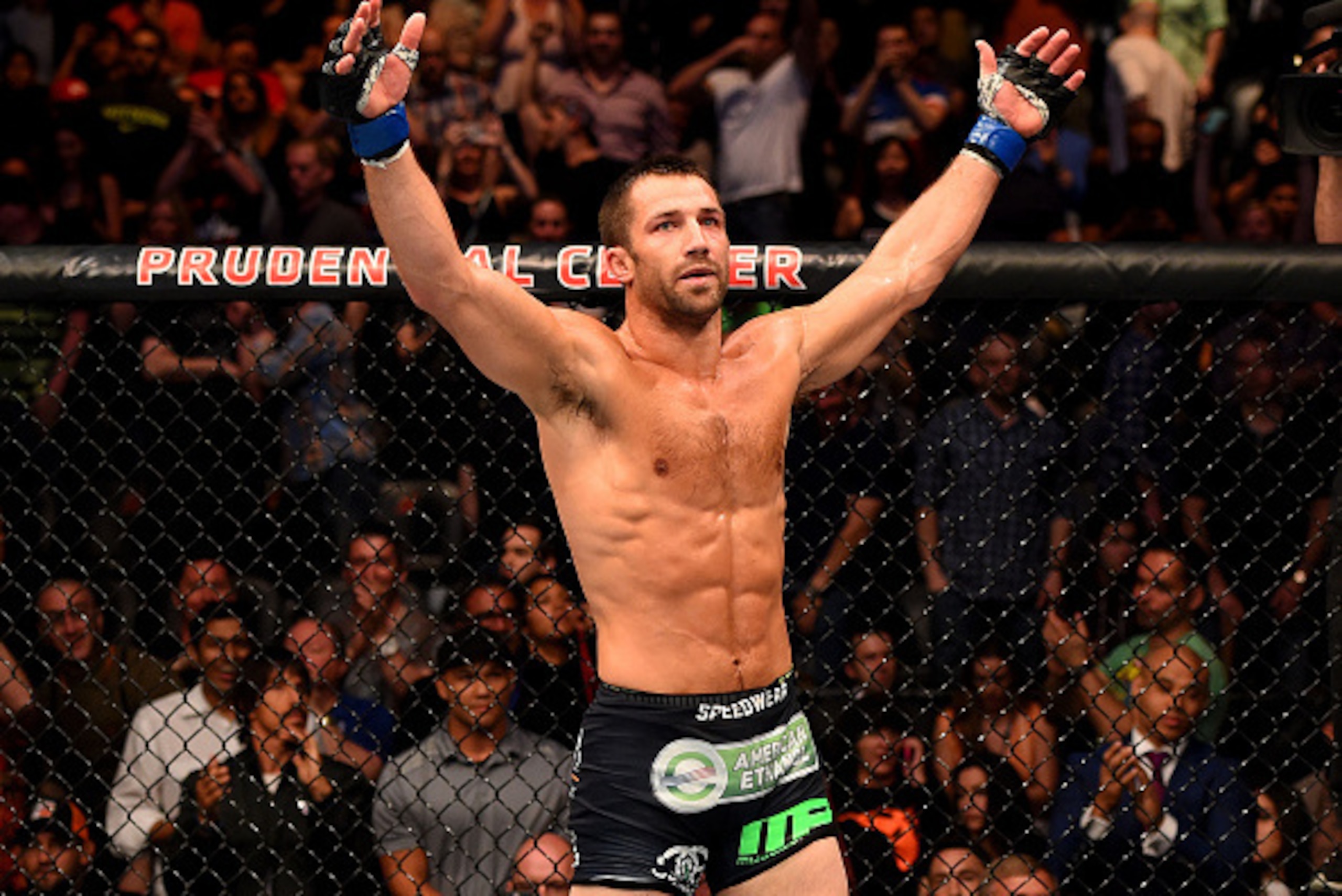 NEWARK, NJ - APRIL 18:  Luke Rockhold celebrates defeating Lyoto Machida of Brazil by tap out in their middleweight bout during the UFC Fight Night event at Prudential Center on April 18, 2015 in Newark, New Jersey.  (Photo by Josh Hedges/Zuffa LLC/Zuffa 