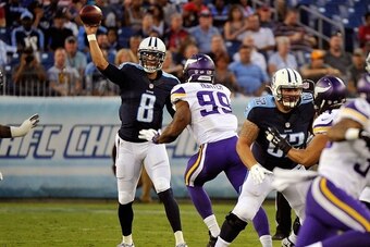 NASHVILLE, TN - SEPTEMBER 03:  Quarterback Marcus Mariota #8 of the Tennessee Titans throws a touchdown pass over the head of Danielle Hunter #99 of the Minnesota Vikings during the first half of a pre-season game at Nissan Stadium on September 3, 2015 in