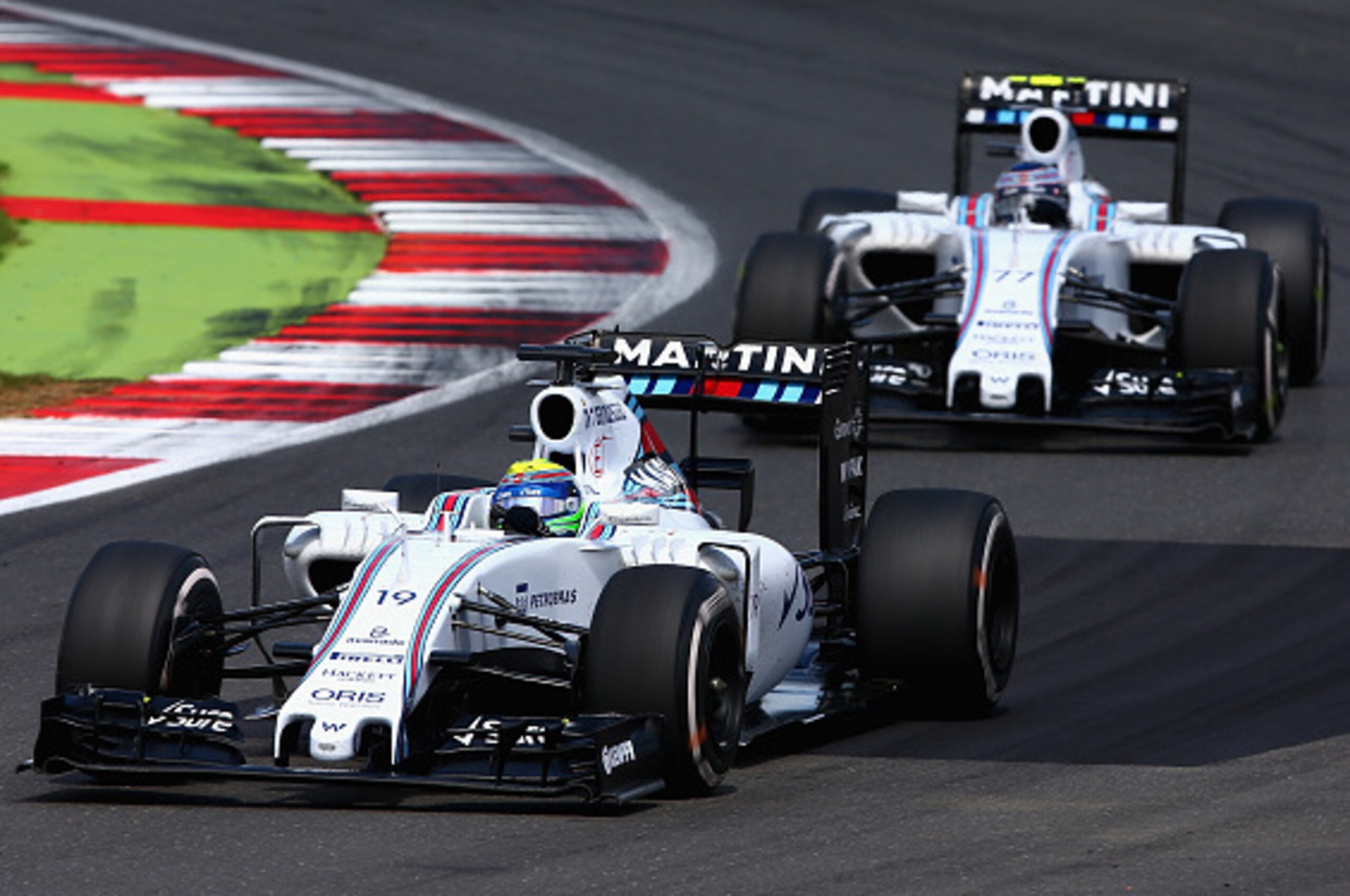 NORTHAMPTON, ENGLAND - JULY 05:  Felipe Massa of Brazil and Williams drives ahead of Valtteri Bottas of Finland and Williams during the Formula One Grand Prix of Great Britain at Silverstone Circuit on July 5, 2015 in Northampton, England.  (Photo by Cliv