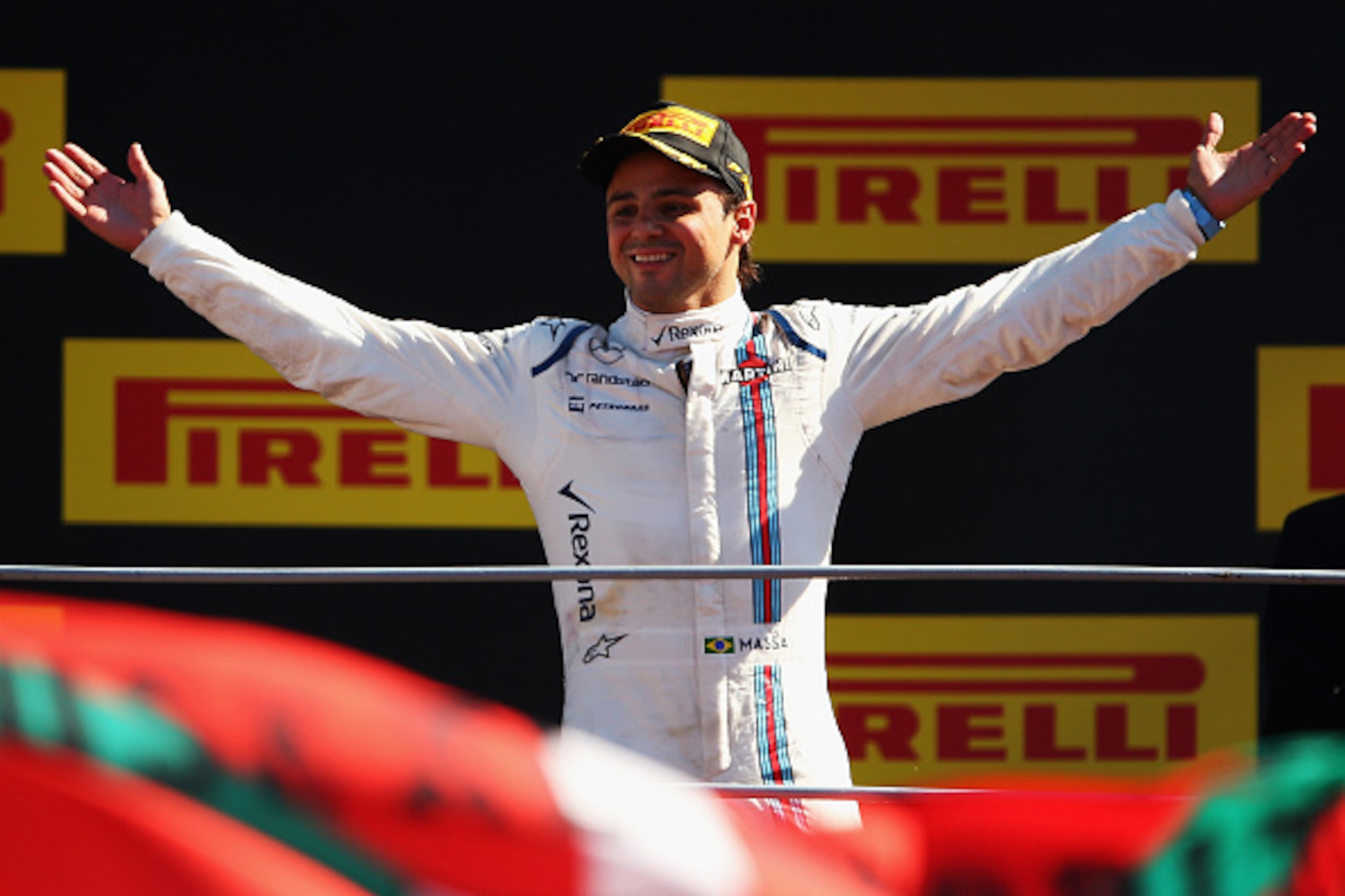MONZA, ITALY - SEPTEMBER 06:  Felipe Massa of Brazil and Williams celebrates on the podium after finishing third in the Formula One Grand Prix of Italy at Autodromo di Monza on September 6, 2015 in Monza, Italy.  (Photo by Bryn Lennon/Getty Images)