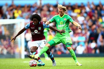 BIRMINGHAM, ENGLAND - AUGUST 29: Carlos Sanchez of Aston Villa and Ola Toivonen of Sunderland compete for the ball during the Barclays Premier League match between Aston Villa and Sunderland at Villa Park on August 29, 2015 in Birmingham, England.  (Photo