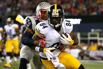 FOXBORO, MA - SEPTEMBER 10:  Antonio Brown #84 of the Pittsburgh Steelers runs after a catch against  Malcolm Butler #21 of the New England Patriots in the first half at Gillette Stadium on September 10, 2015 in Foxboro, Massachusetts.  (Photo by Jim Roga