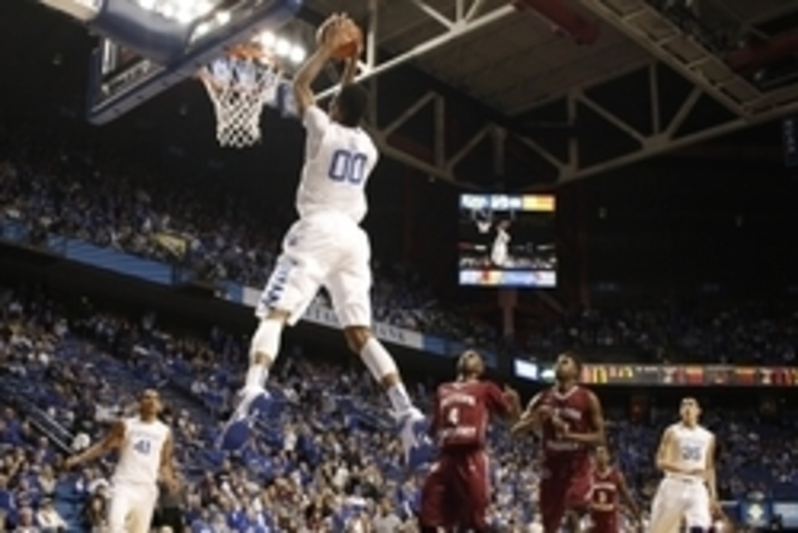 Dec 7, 2014; Lexington, KY, USA; Kentucky Wildcats forward Marcus Lee (00) dunks the ball against the Eastern Kentucky Colonels in the second half at Rupp Arena. The Kentucky Wildcats  defeated the Eastern Kentucky Colonels 82-49. Mandatory Credit: Mark Z