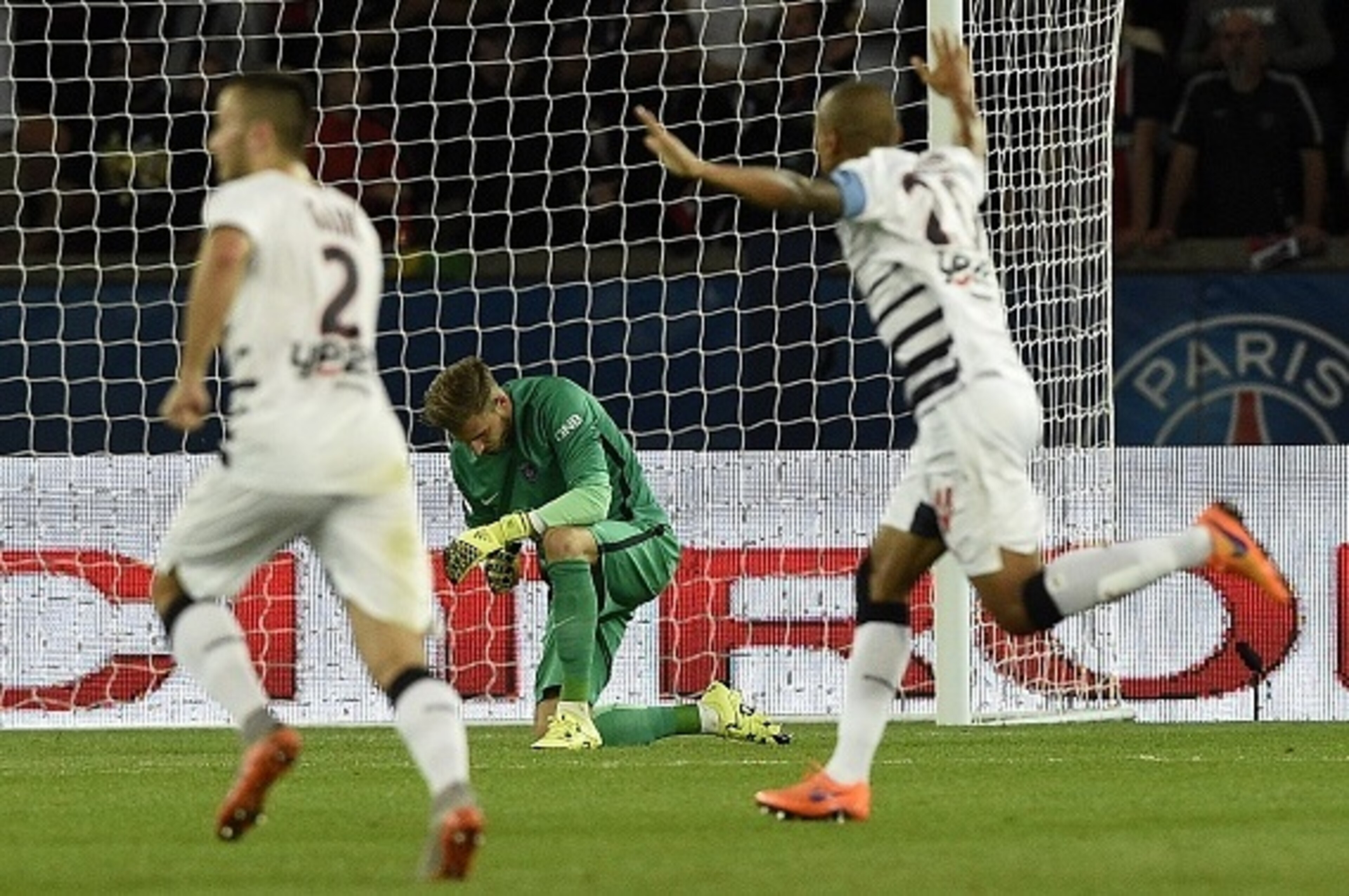 Bordeaux's players celebrate past Paris Saint-Germain's German goalkeeper Kevin Trapp after scoring a goal during the French L1 football match between Paris Saint-Germain (PSG) and Bordeaux at the Parc des Princes stadium in Paris on September 11, 2015. A