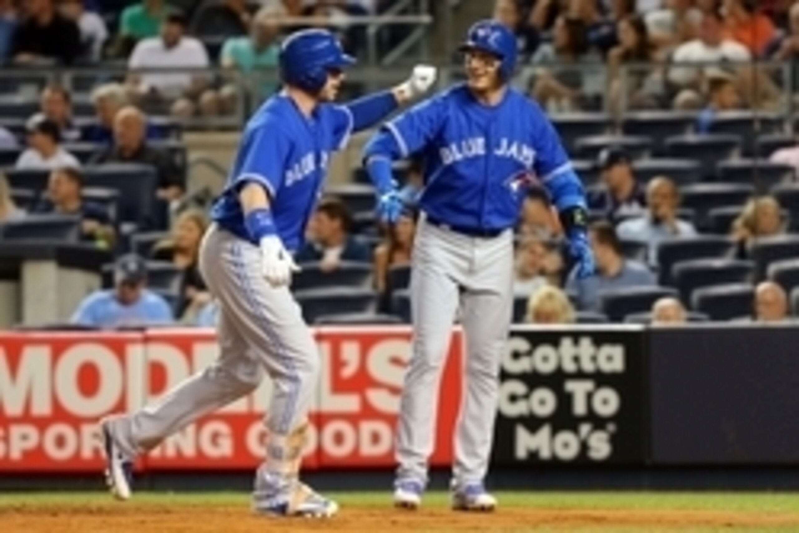 Sep 11, 2015; Bronx, NY, USA; Toronto Blue Jays first baseman Justin Smoak (13) celebrates his a two-run home run against the New York Yankees with Toronto Blue Jays shortstop Troy Tulowitzki (2) during the first inning at Yankee Stadium. Mandatory Credit Sep 11, 2015; Bronx, NY, USA; Toronto Blue Jays first baseman Justin Smoak (13) celebrates his a two-run home run against the New York Yankees with Toronto Blue Jays shortstop Troy Tulowitzki (2) during the first inning at Yankee Stadium. Mandatory Credit