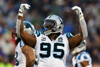 CHARLOTTE, NC - JANUARY 03:  Charles Johnson #95 of the Carolina Panthers celebrates during their NFC Wild Card Playoff game against the Arizona Cardinals at Bank of America Stadium on January 3, 2015 in Charlotte, North Carolina.  (Photo by Streeter Leck