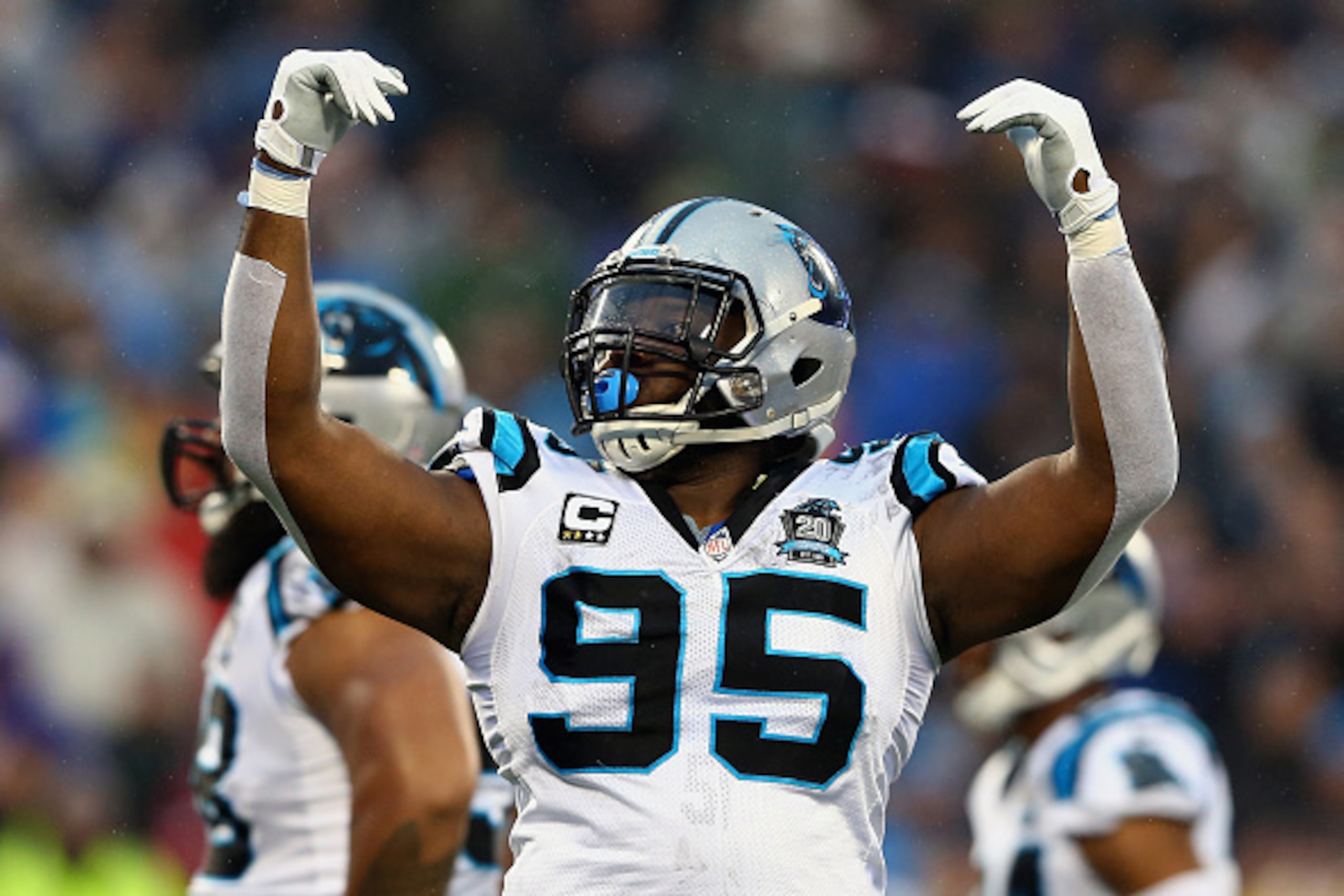 CHARLOTTE, NC - JANUARY 03:  Charles Johnson #95 of the Carolina Panthers celebrates during their NFC Wild Card Playoff game against the Arizona Cardinals at Bank of America Stadium on January 3, 2015 in Charlotte, North Carolina.  (Photo by Streeter Leck