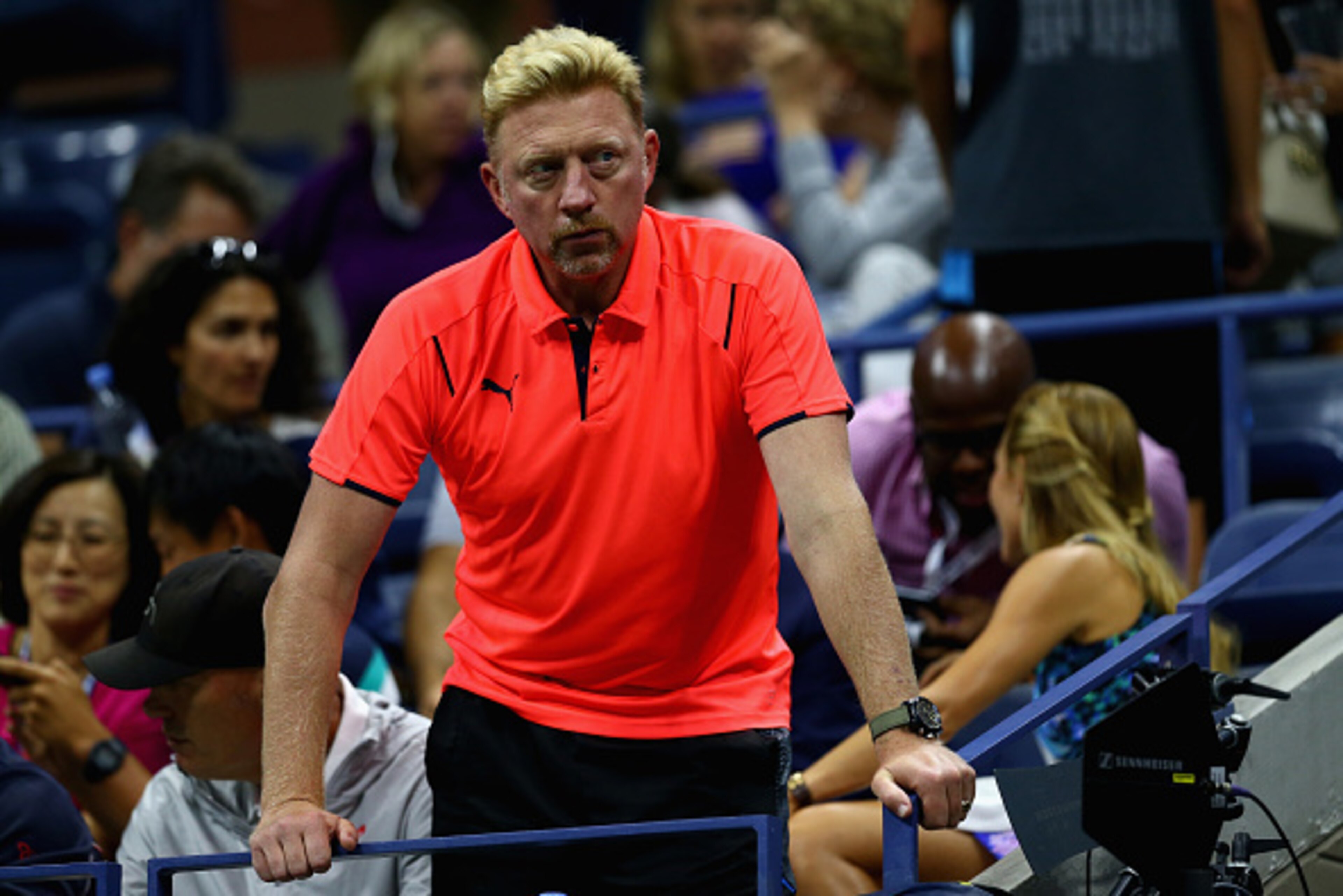 NEW YORK, NY - SEPTEMBER 06:  Boris Becker coach of Novak Djokovic of Serbia watches him play against Roberto Bautista Agut of Spain in their mens singles fourth round match on Day Seven of the 2015 US Open at the USTA Billie Jean King National Tennis Cen