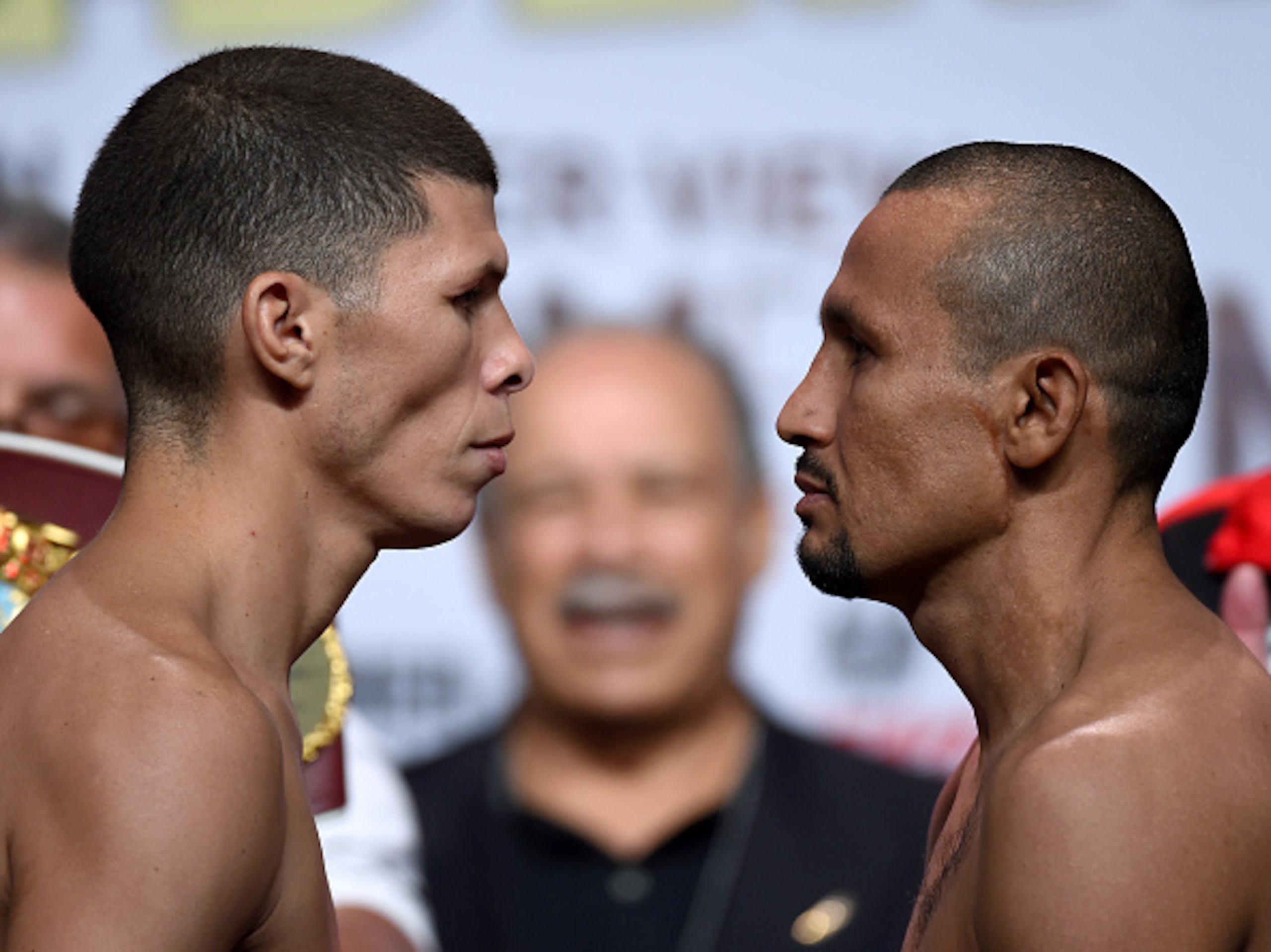 LAS VEGAS, NV - SEPTEMBER 11:  Boxers Roman Martinez (L) and Orlando Salido face off during their official weigh-in at MGM Grand Garden Arena on September 11, 2015 in Las Vegas, Nevada. Martinez will defend his WBO junior lightweight title against Salido 