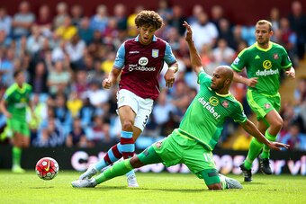 BIRMINGHAM, ENGLAND - AUGUST 29: Rudy Gestede of Aston Villa and Younes Kaboul of Sunderland compete for the ball during the Barclays Premier League match between Aston Villa and Sunderland at Villa Park on August 29, 2015 in Birmingham, England.  (Photo 