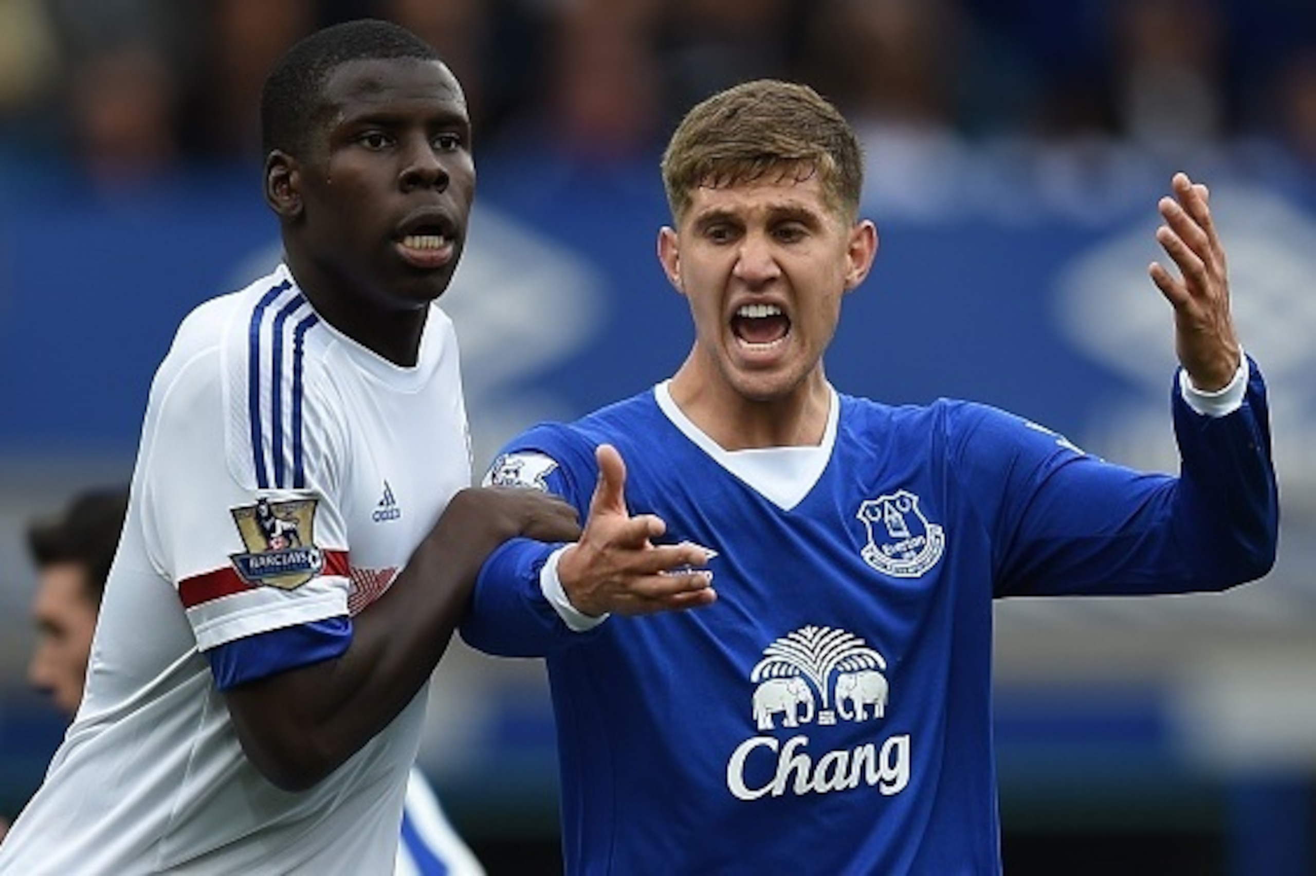 Everton's English defender John Stones (R) reacts as he vies against Chelsea's French defender Kurt Zouma during the English Premier League football match between Everton and Chelsea at Goodison Park in Liverpool on September 12, 2015. AFP PHOTO / PAUL EL