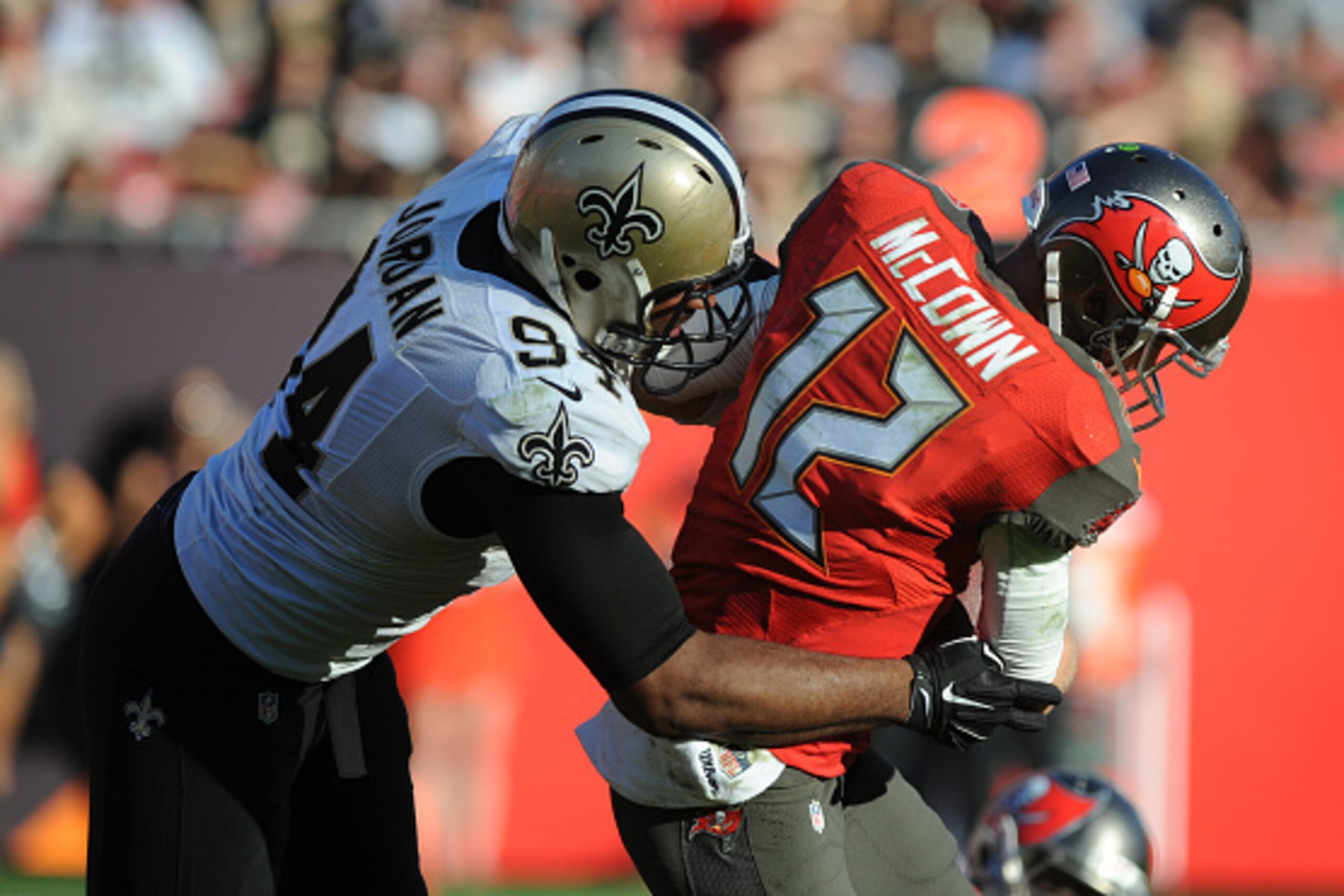 TAMPA, FL - DECEMBER 28: Defensive end Cameron Jordan #94 of the New Orleans Saints sacks quarterback Josh McCown #12 of the Tampa Bay Buccaneers in the fourth quarter at Raymond James Stadium on December 28, 2014 in Tampa, Florida. (Photo by Cliff McBrid