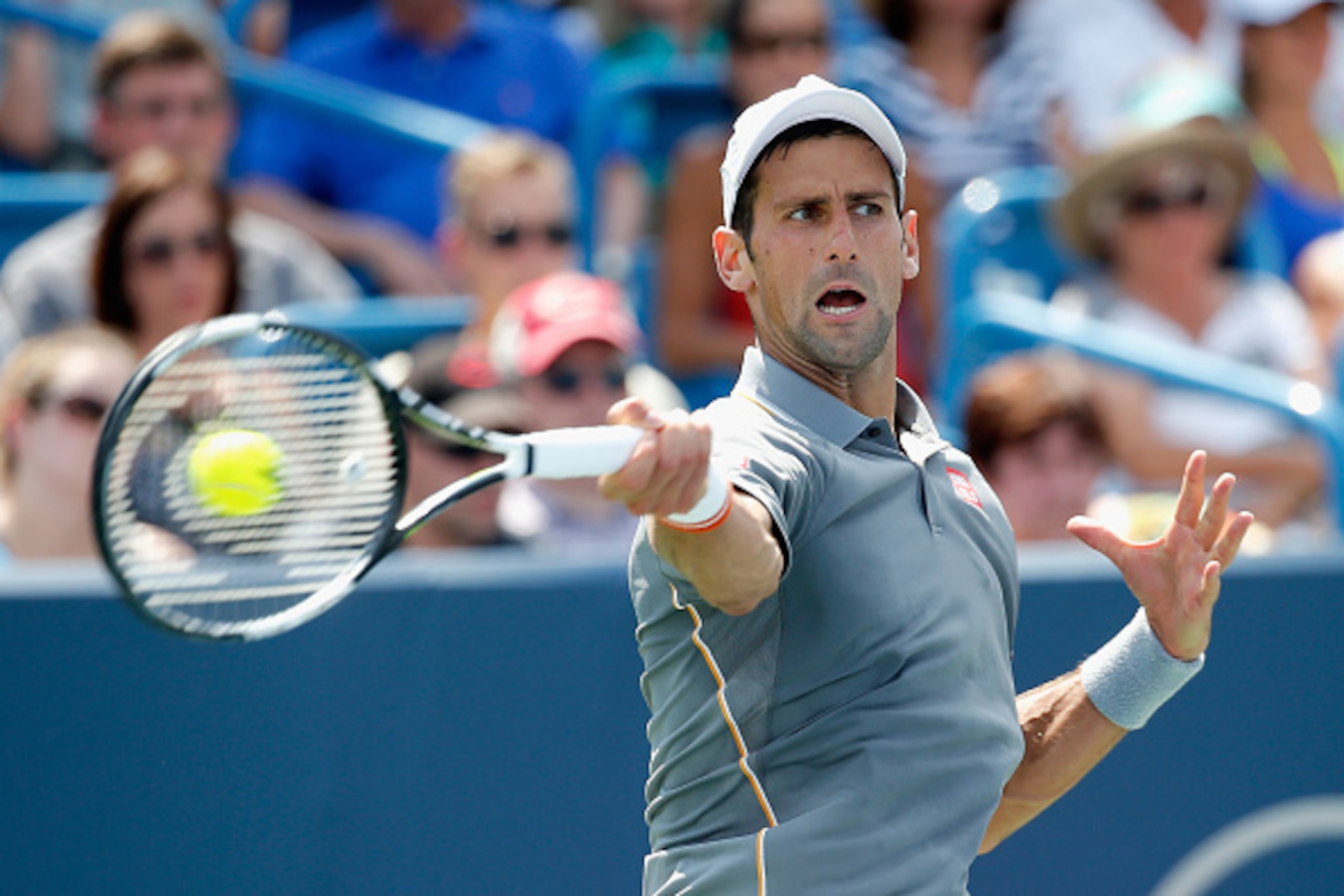 CINCINNATI, OH - AUGUST 23:  Novak Djokovic of Serbia returns a shot to Roger Federer of Switzerland during the mens finals of the Western & Southern Open at the Linder Family Tennis Center on August 23, 2015 in Cincinnati, Ohio.  (Photo by Rob Carr/Getty