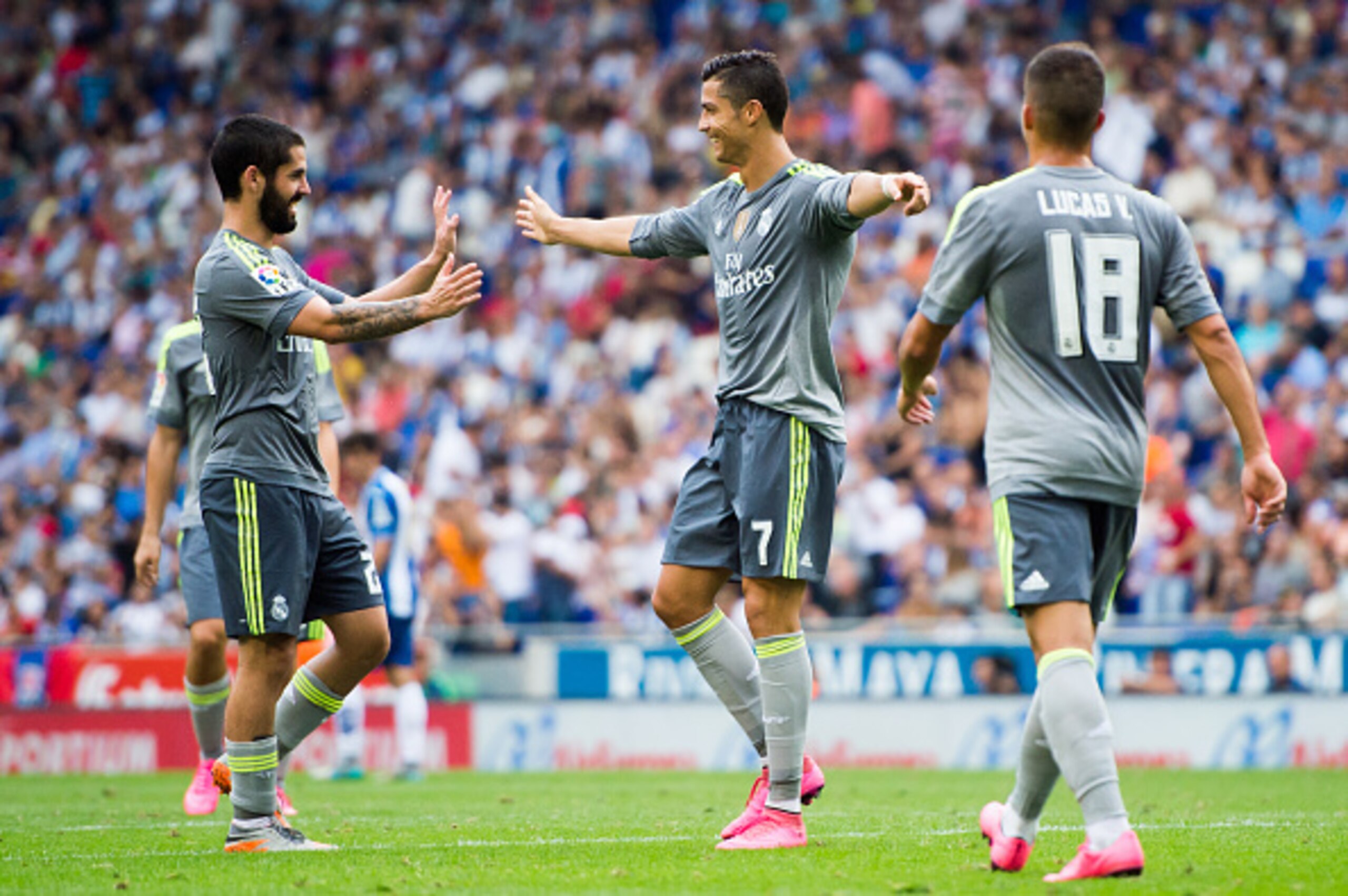 BARCELONA, SPAIN - SEPTEMBER 12:  Cristiano Ronaldo of Real Madrid CF celebrates with his teammate Francisco Alarcon 'Isco' (L) after scoring their team's sixth goal during the La Liga match between RCD Espanyol and Real Madrid CF at Cornella-El Prat Stad