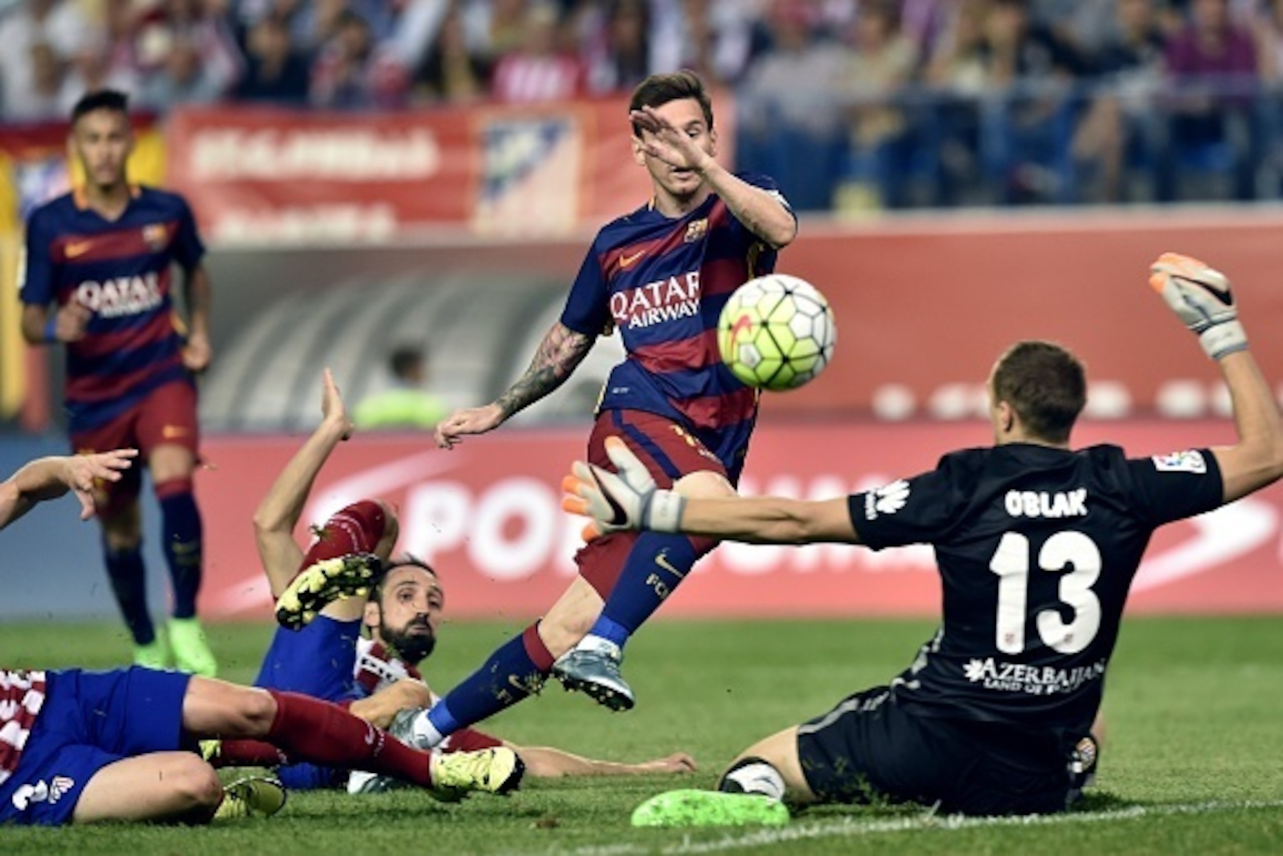 Barcelona's Argentinian forward Lionel Messi (C) scores during the UEFA Champions League semi-final second leg football match Real Madrid FC vs Juventus at the Santiago Bernabeu stadium in Madrid on May 13, 2015.   AFP PHOTO/ GERARD JULIEN        (Photo c