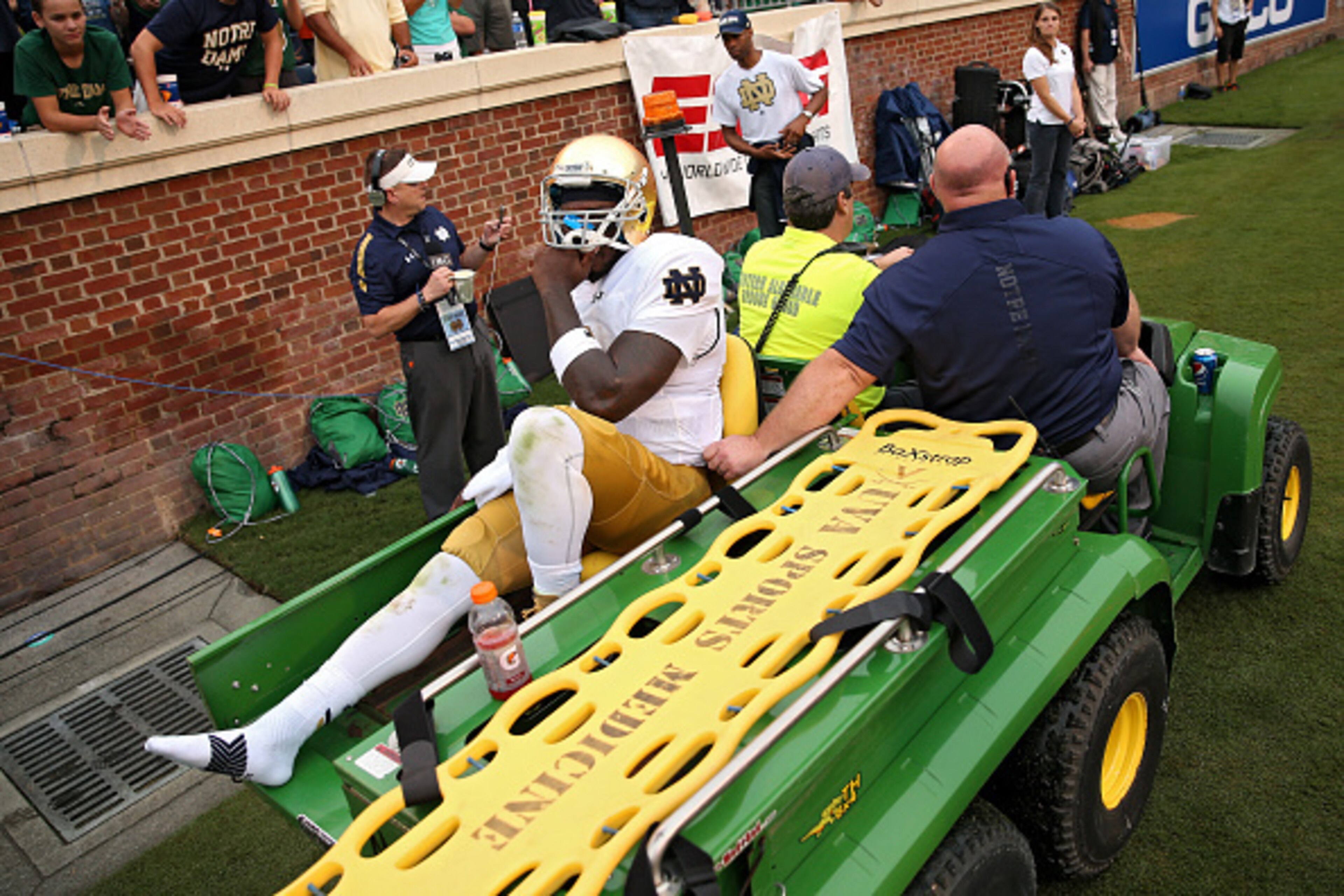 CHARLOTTESVILLE, VA - SEPTEMBER 12: Quarterback Malik Zaire #8 of the Notre Dame Fighting Irish is carted off of the field after being injured against the Virginia Cavaliers in the third quarter at Scott Stadium on September 12, 2015 in Charlottesville, V