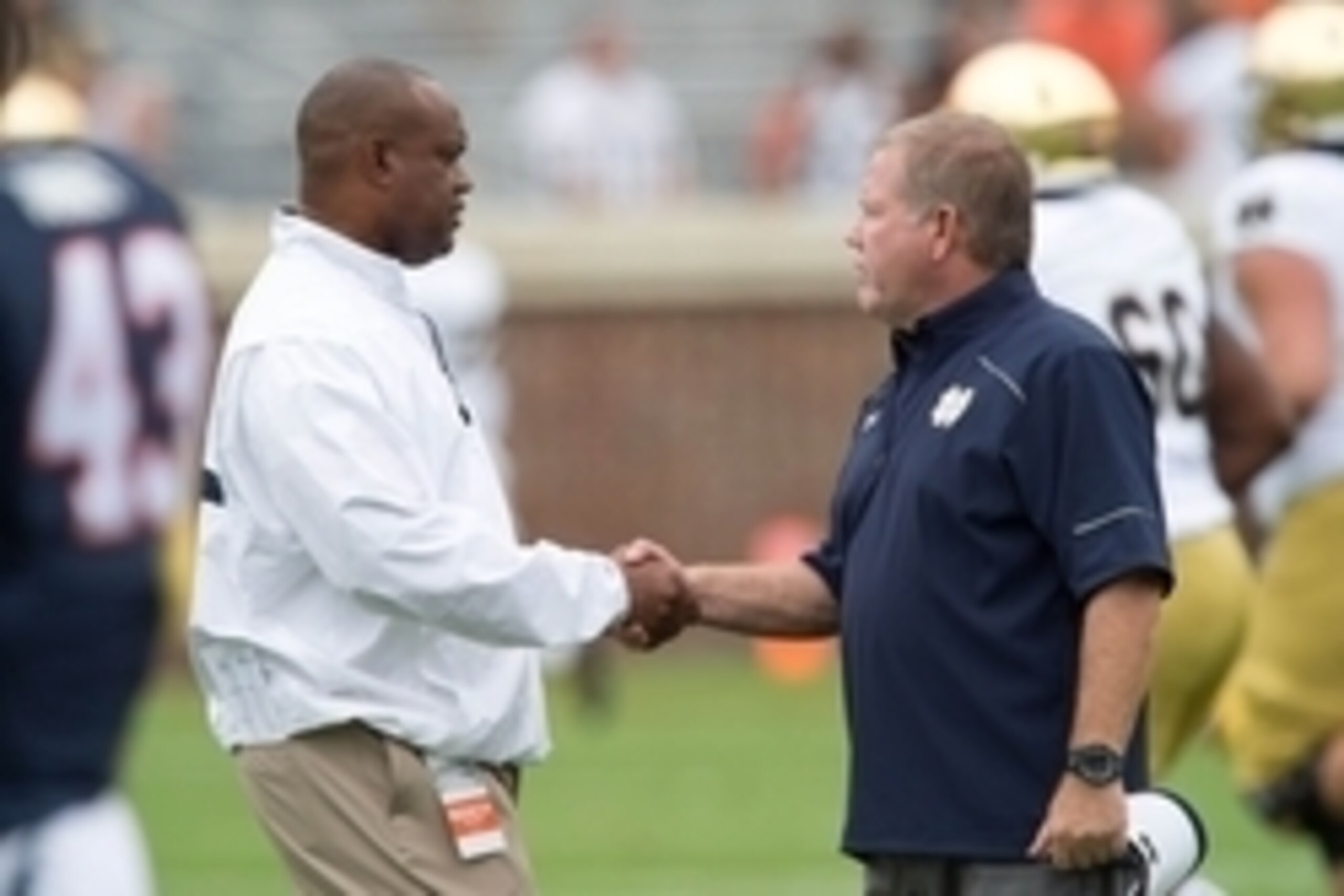 Sep 12, 2015; Charlottesville, VA, USA; Virginia Cavaliers head coach Mike London and Notre Dame Fighting Irish head coach Brian Kelly shake hands before the game at Scott Stadium. Mandatory Credit: Matt Cashore-USA TODAY Sports