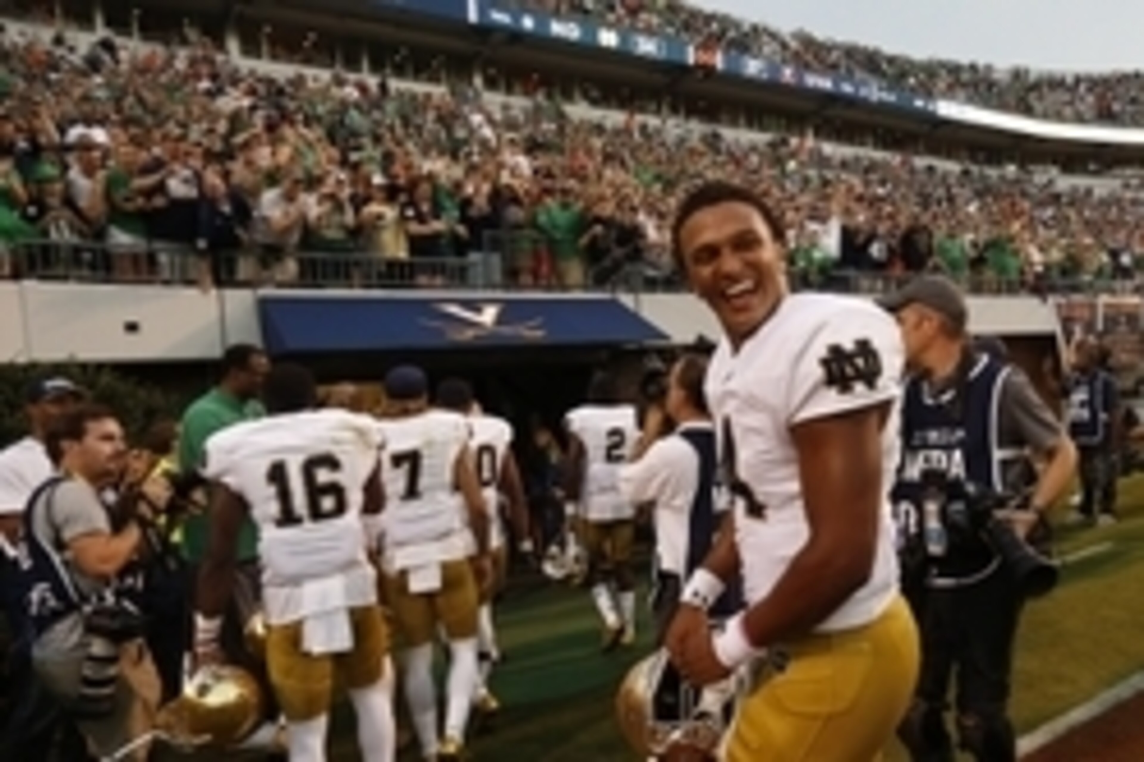 Sep 12, 2015; Charlottesville, VA, USA; Notre Dame Fighting Irish quarterback DeShone Kizer (14) celebrates while leaving the field after the Fighting Irish' game against the Virginia Cavaliers at Scott Stadium. The Fighting Irish won 34-27. Mandatory Cre