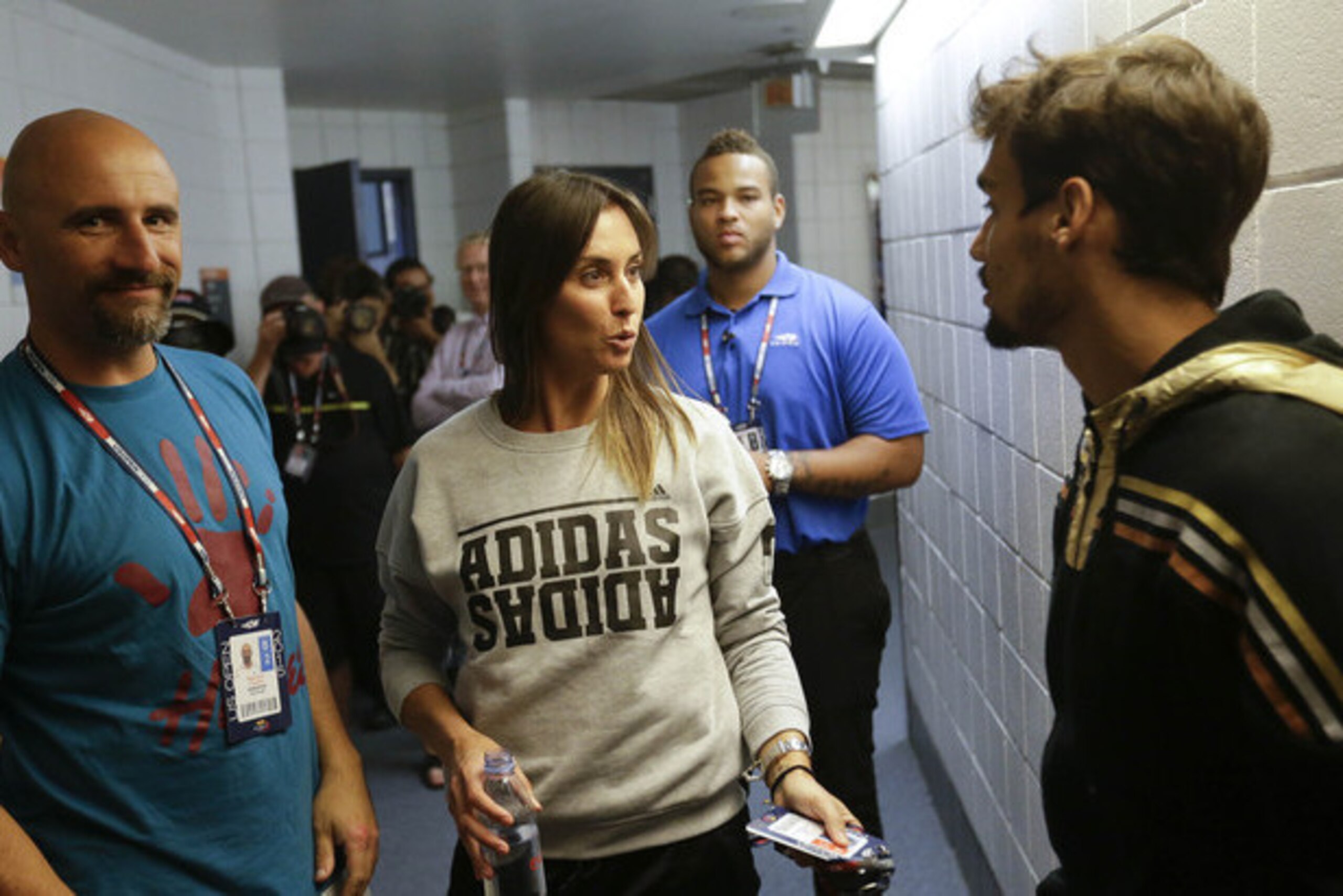 Flavia Pennetta talks with fiance Fabio Fognini after she won the 2015 U.S. Open.