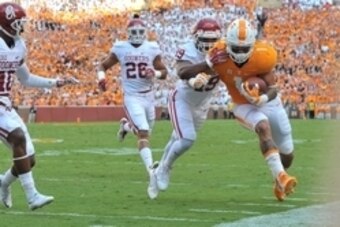 Sep 12, 2015; Knoxville, TN, USA; Tennessee Volunteers running back Jalen Hurd (1) rushes against Oklahoma Sooners linebacker Eric Striker (19) during the first half at Neyland Stadium. Mandatory Credit: Jim Brown-USA TODAY Sports