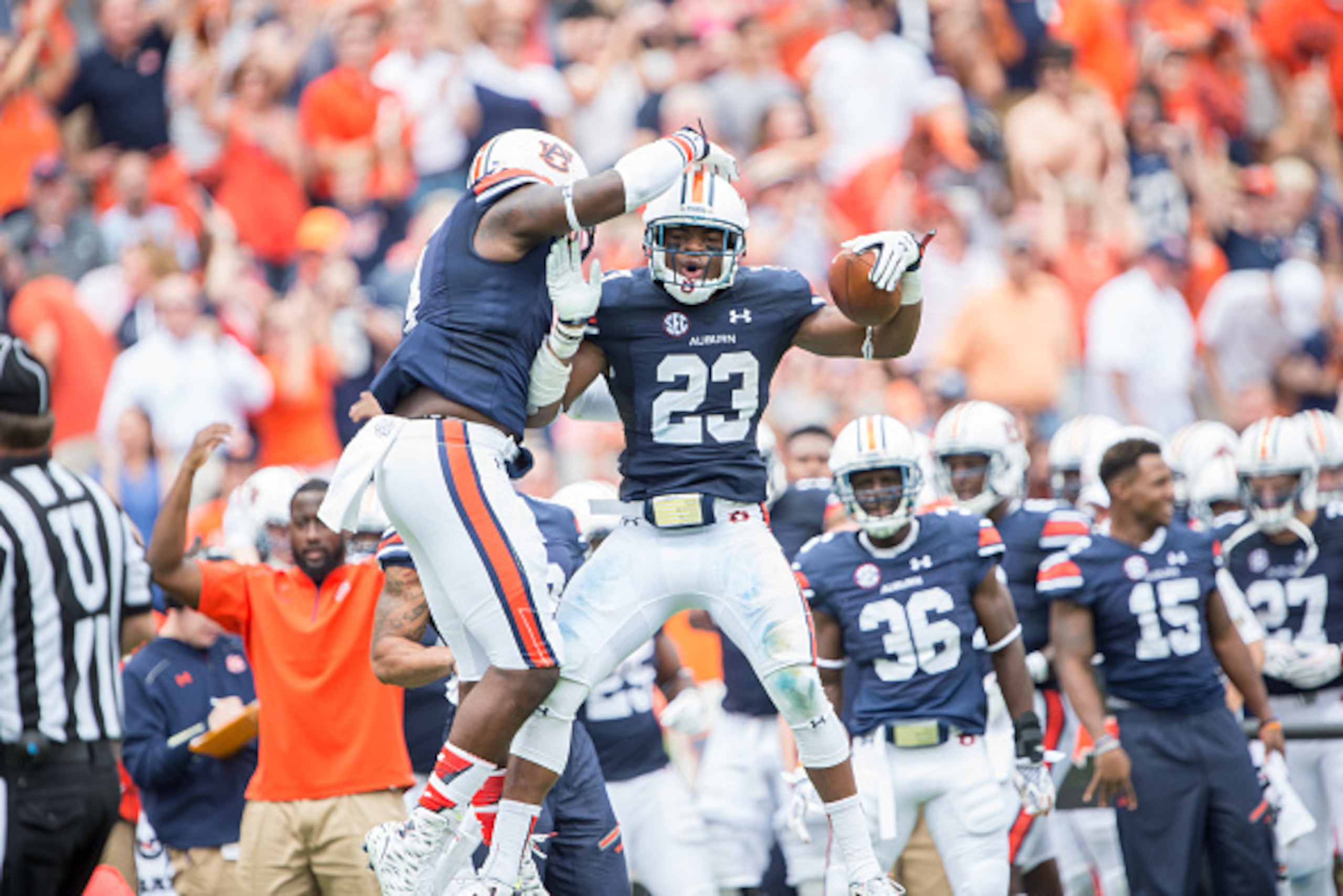 AUBURN, AL - SEPTEMBER 12: Defensive back Johnathan Ford #23 of the Auburn Tigers celebrates with linebacker Jeff Holland #4 of the Auburn Tigers after intercepting a pass during their game against the Jacksonville State Gamecocks on September 12, 2015 at