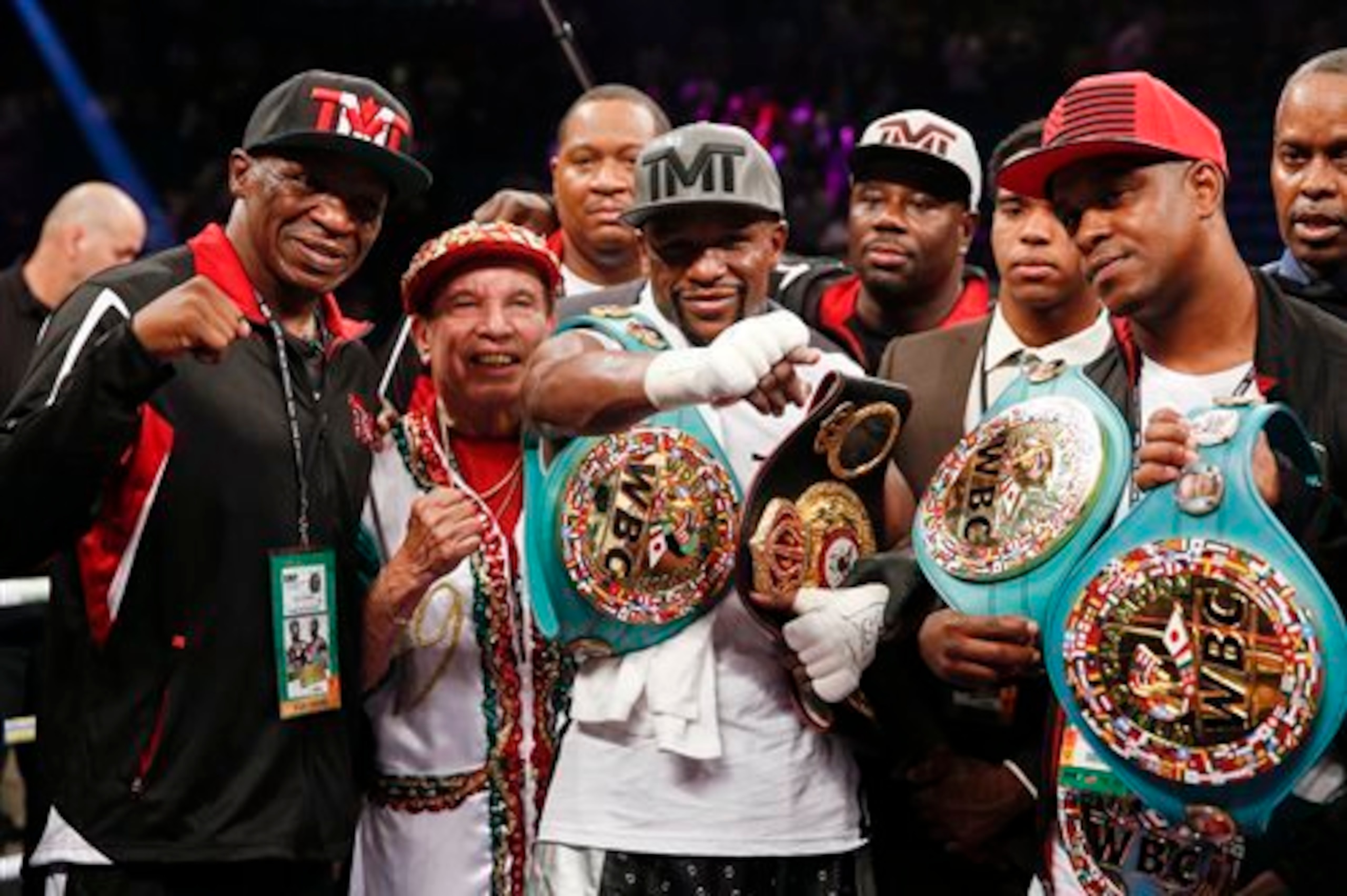 Mayweather and his team put his championship hardware on display after the decision was announced.