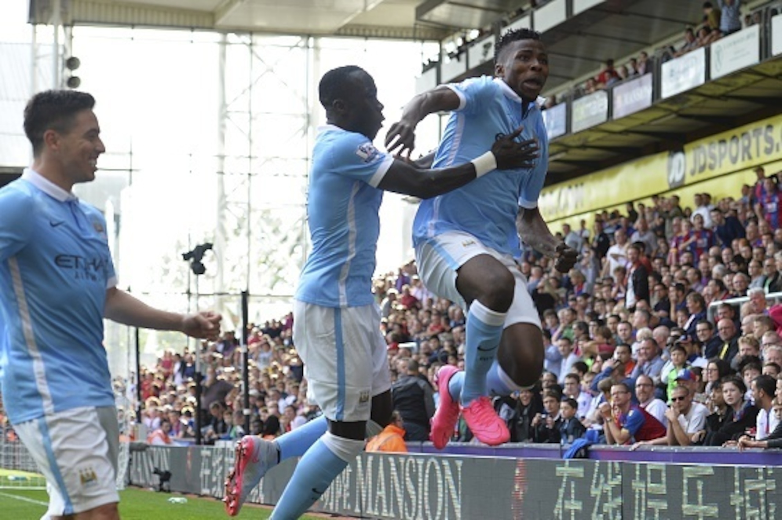 Manchester City's Nigerian striker Kelechi Iheanacho (R) celebrates scoring the winning goal during the English Premier League football match between Crystal Palace and Manchester City at Selhurst Park in London on September 12, 2015. AFP PHOTO / GLYN KIR