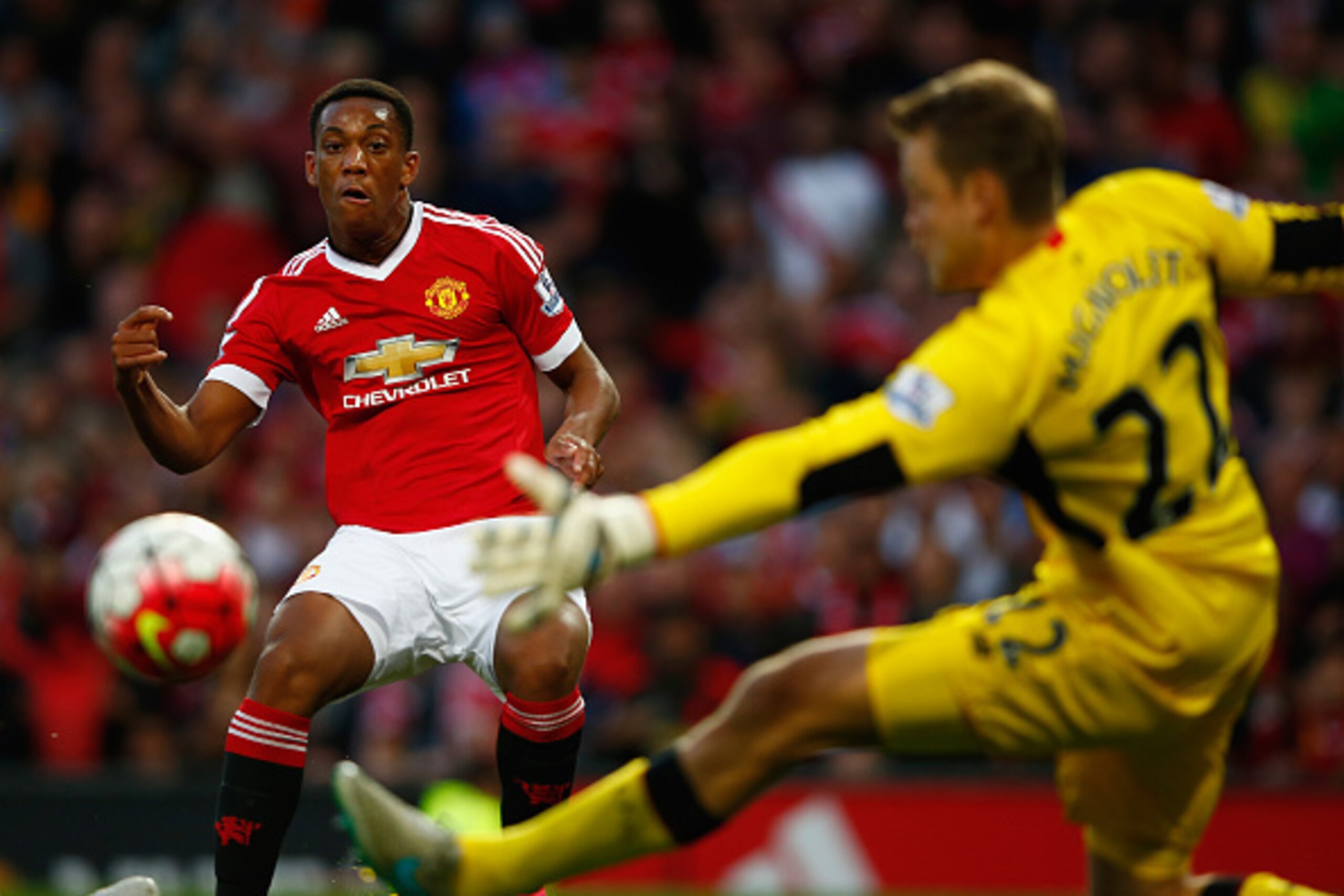 MANCHESTER, ENGLAND - SEPTEMBER 12: Anthony Martial of Manchester United scores past Simon Mignolet of Liverpool for his team's third goal during the Barclays Premier League match between Manchester United and Liverpool at Old Trafford on September 12, 2 MANCHESTER, ENGLAND - SEPTEMBER 12: Anthony Martial of Manchester United scores past Simon Mignolet of Liverpool for his team's third goal during the Barclays Premier League match between Manchester United and Liverpool at Old Trafford on September 12, 2
