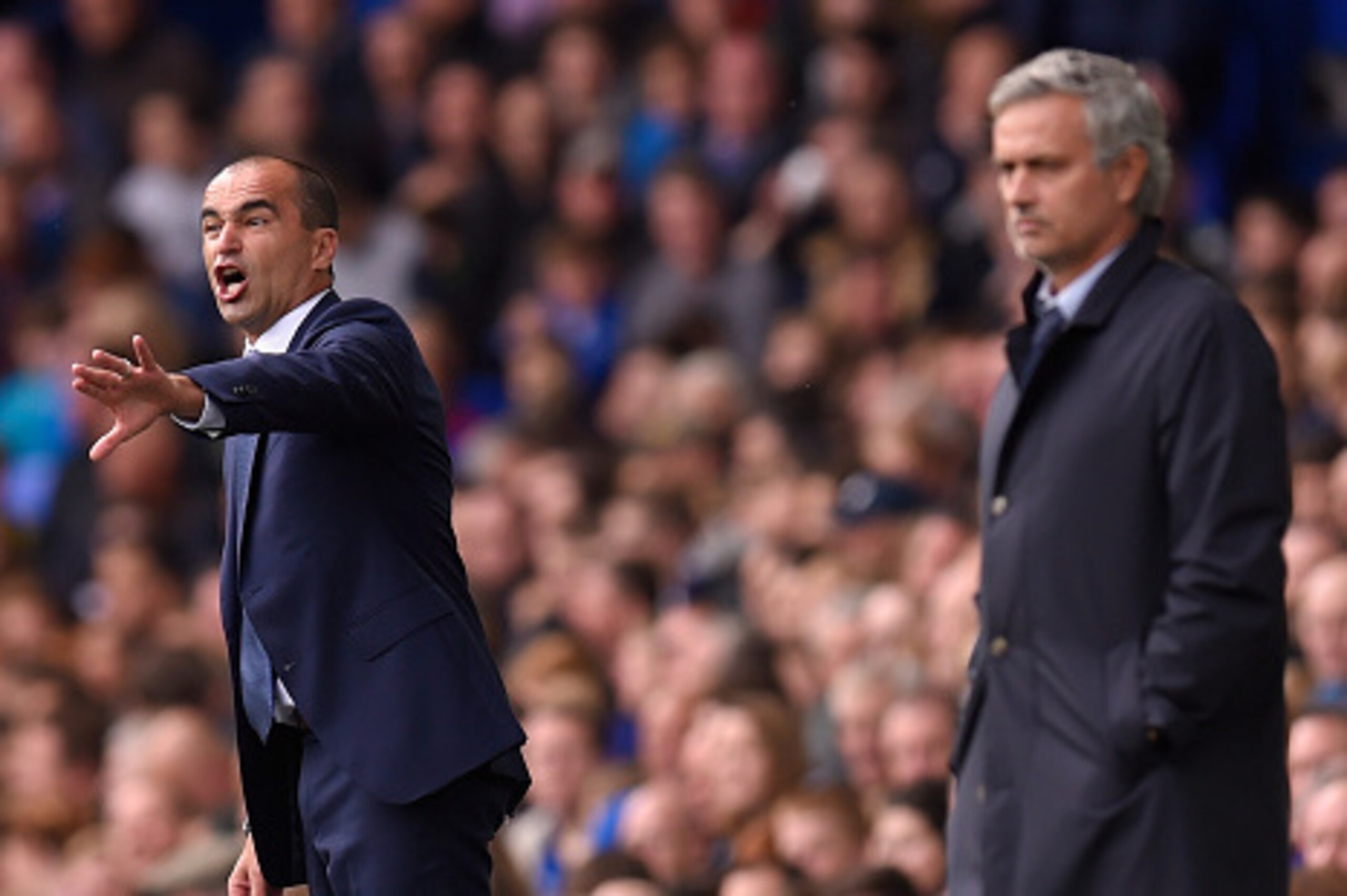 LIVERPOOL, ENGLAND - SEPTEMBER 12:  Roberto Martinez (l) manager of Everton and Jose Mourinho, manager of Chelsea react during the Barclays Premier League match between Everton and Chelsea at Goodison Park on September 12, 2015 in Liverpool, United Kingdo