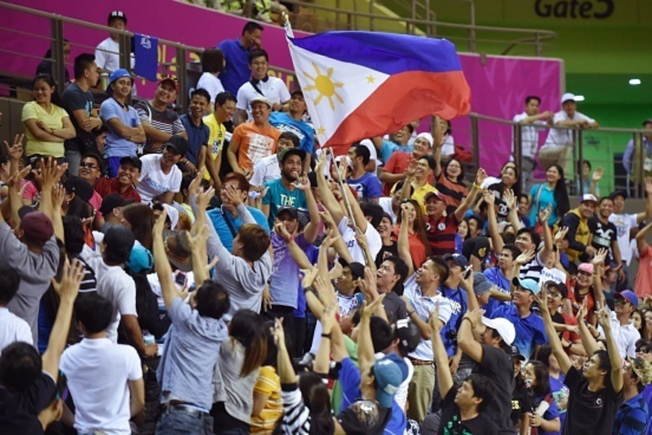Philippines basketball supporters fulfill the stadium during the basketball men preliminary round group E match of Philippines against Iran, at the Incheon International Velodrome during the 17th Asian Games in Incheon on September 25, 2014.   AFP PHOTO /
