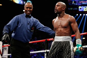 LAS VEGAS, NV - SEPTEMBER 12:  Floyd Mayweather Jr. and referee Kenny Bayless stand in the ring during the WBC/WBA welterweight title fight against Andre Berto at MGM Grand Garden Arena on September 12, 2015 in Las Vegas, Nevada.  (Photo by Ezra Shaw/Gett