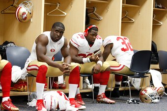 DENVER, CO - AUGUST 29: Reggie Bush #23 and Carlos Hyde #28 of the San Francisco 49ers relax in the locker room prior to the game against the Denver Broncos at Sports Authority Field on August 29, 2015 in Denver, Colorado. The Broncos defeated the 49ers 1