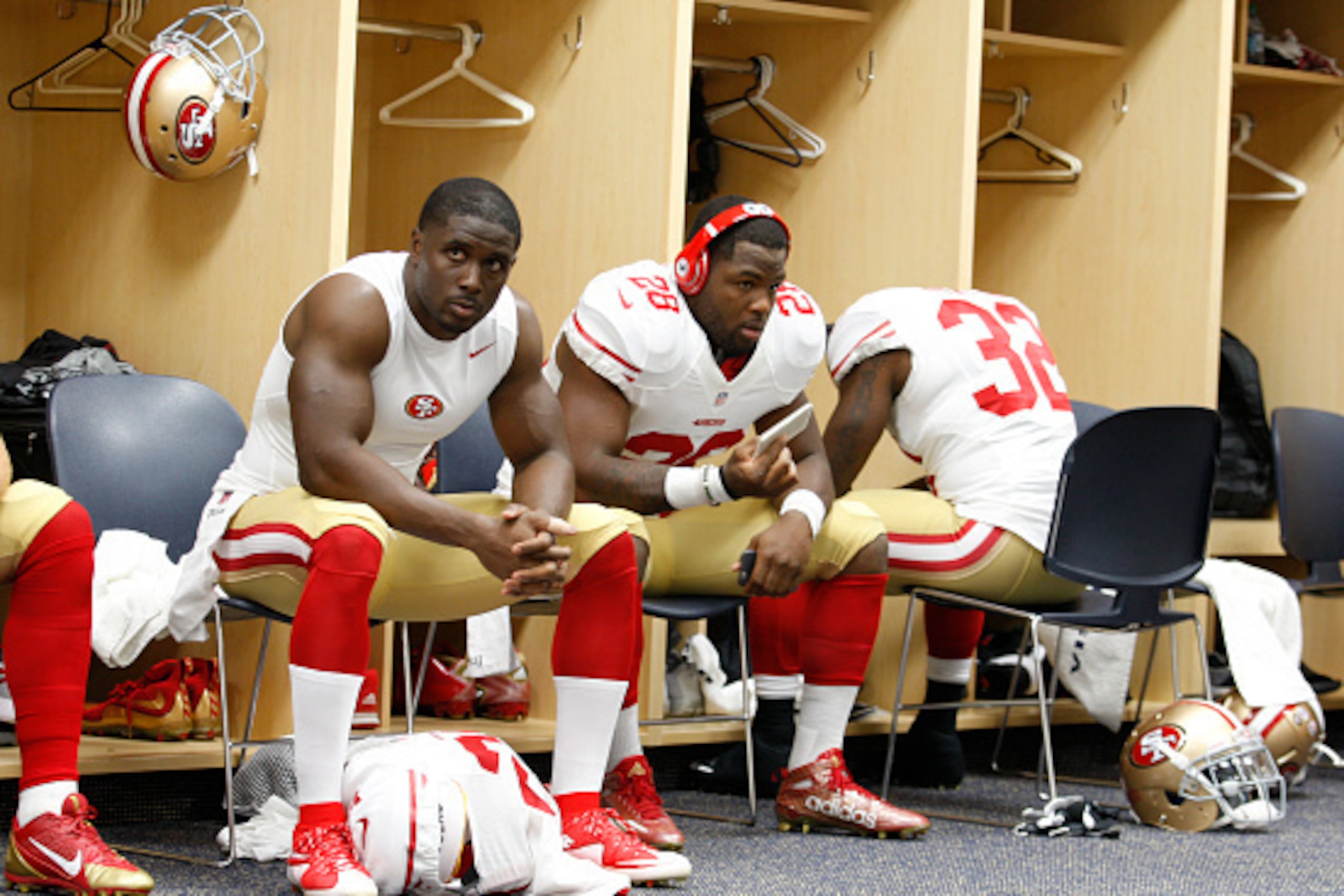 DENVER, CO - AUGUST 29: Reggie Bush #23 and Carlos Hyde #28 of the San Francisco 49ers relax in the locker room prior to the game against the Denver Broncos at Sports Authority Field on August 29, 2015 in Denver, Colorado. The Broncos defeated the 49ers 1