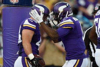 MINNEAPOLIS, MN - AUGUST 15: Zach Line #48 and Teddy Bridgewater #5 of the Minnesota Vikings celebrate a touchdown against the Tampa Bay Buccaneers during the first quarter of the preseason game on August 15, 2015 at TCF Bank Stadium in Minneapolis, Minne