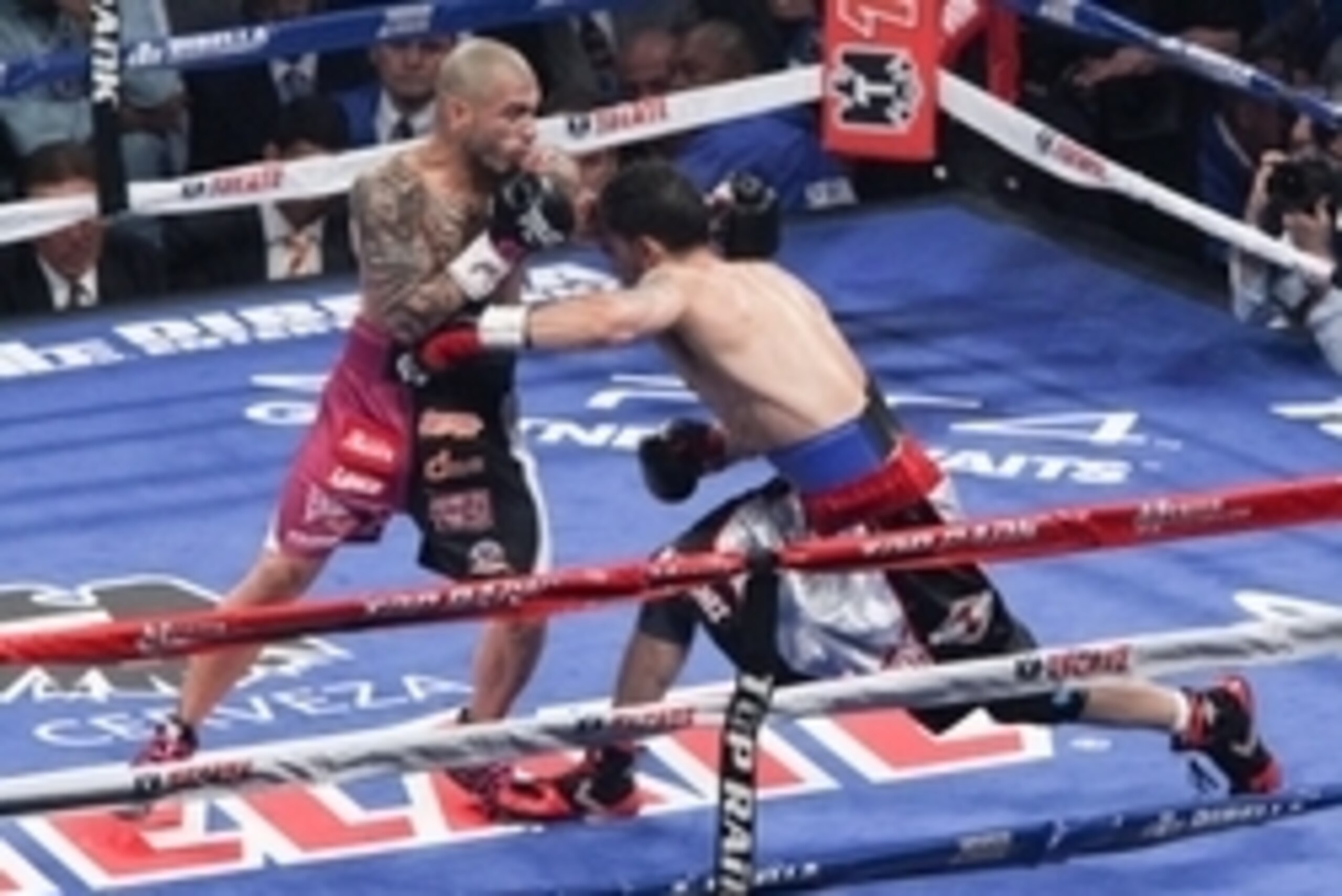 Jun 7, 2014; New York, NY, USA;   Sergio Martinez hits Miguel Cotto with body blow in the second round of WBC World Middleweight fight at Madison Square Garden. Mandatory Credit: Noah K. Murray-USA TODAY Sports
