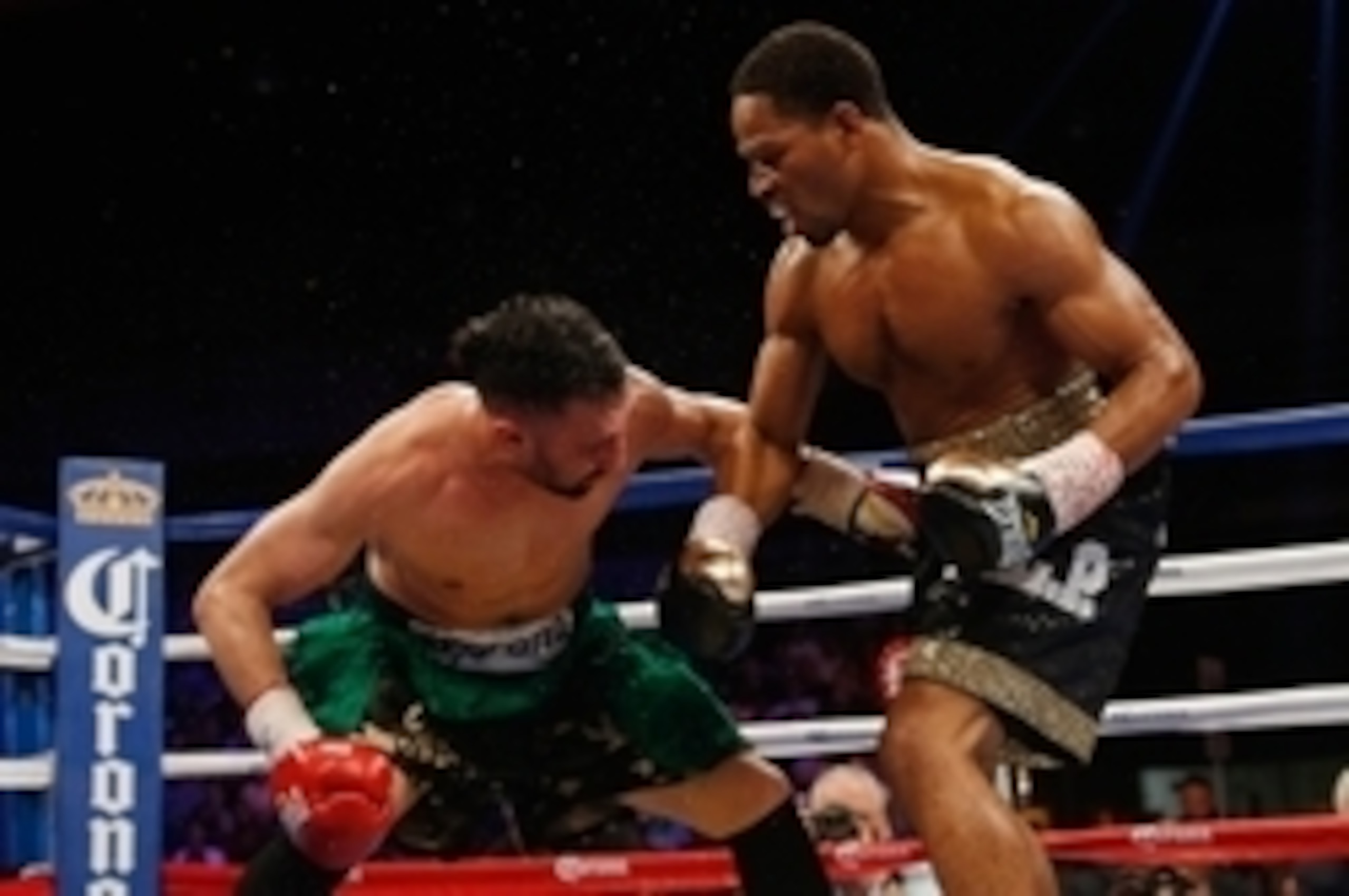 Apr 19, 2014; Washington, DC, USA; Shawn Porter (black gloves and Paulie Malignaggi (red gloves) in action during their bout at DC Armory. Mandatory Credit: Geoff Burke-USA TODAY Sports