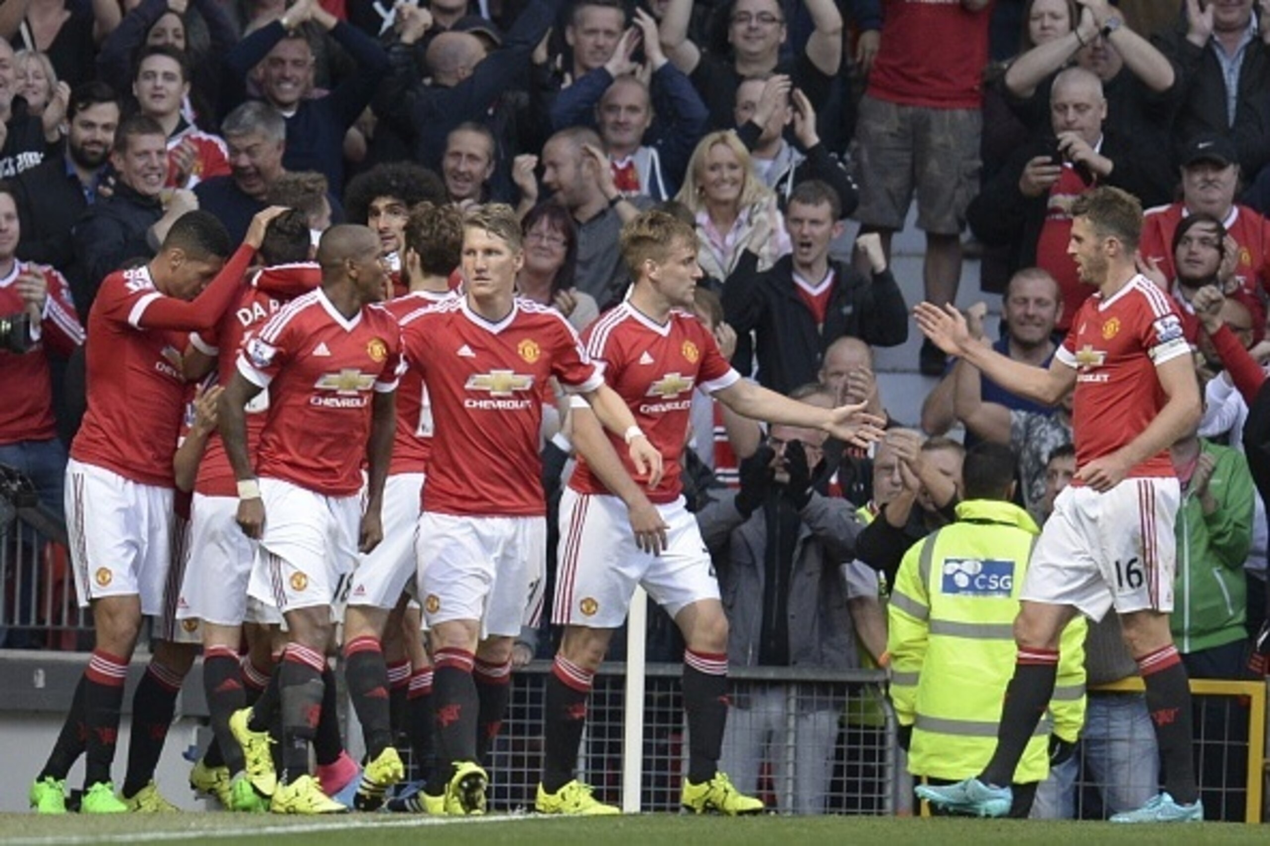 Manchester United players celebrates their second goal scored by Manchester United's Spanish midfielder Ander Herrera during the English Premier League football match between Manchester United and Liverpool at Old Trafford in Manchester, north west Englan