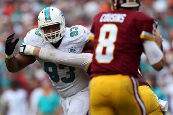 LANDOVER, MD - SEPTEMBER 13: Defensive tackle Ndamukong Suh #93 of the Miami Dolphins defends in the first half during a game against the Washington Redskins at FedExField on September 13, 2015 in Landover, Maryland. (Photo by Patrick Smith/Getty Images)